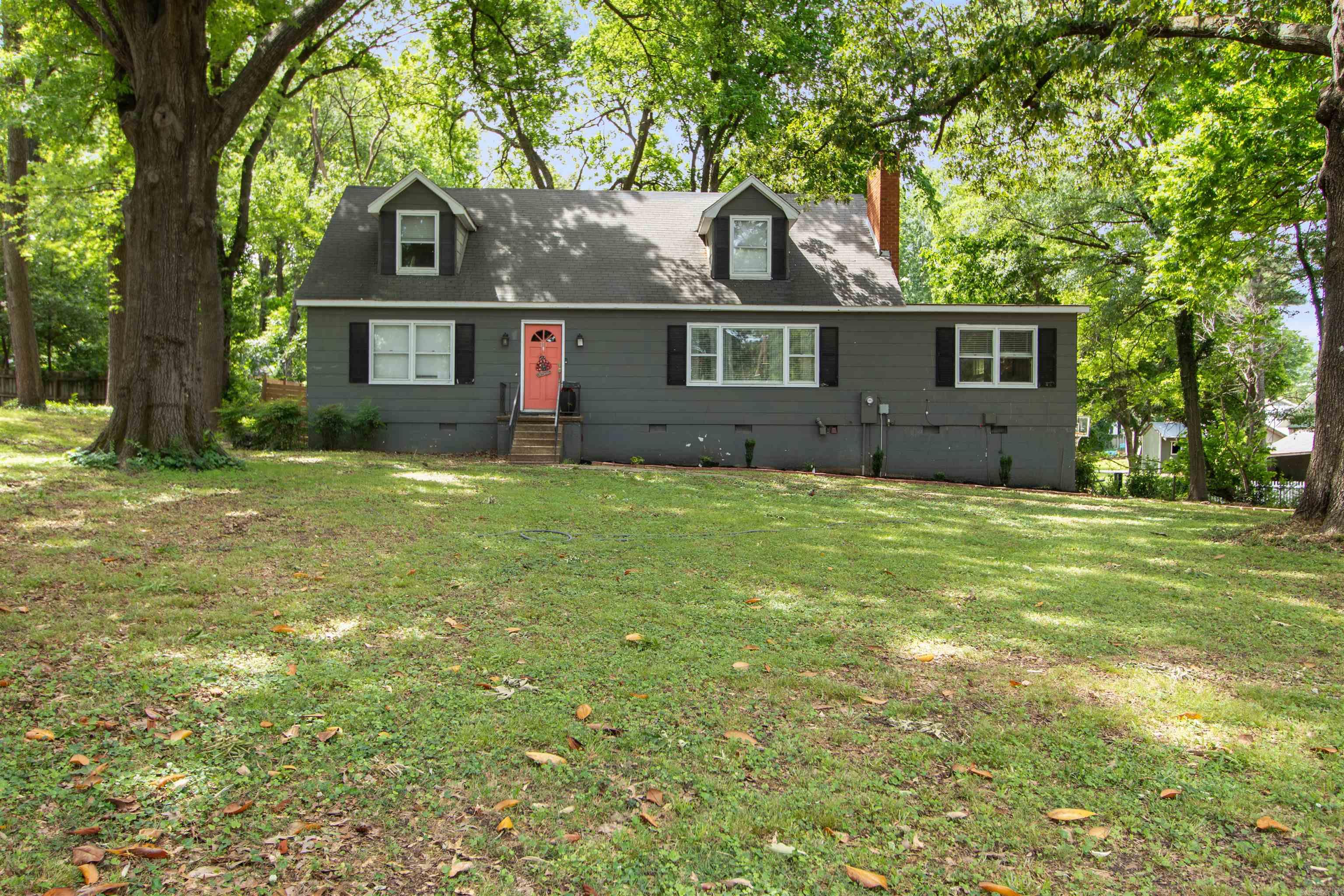 Welcome to the market! Nestled on a beautiful wooded lot in the heart of central Jonesboro, this spacious 4 bedroom, 2 bathroom home offers 2,240 sq ft of character, charm, and versatility. Situated on approximately .46 acres, the property is surrounded by mature trees creating a peaceful setting while still being conveniently located near everything downtown Jonesboro has to offer. Inside, you'll find multiple living spaces including a formal living room featuring a cozy fireplace and an additional den perfect for a second living area, game room, office space, or entertaining guests. The layout provides plenty of room for both everyday living and hosting family and friends. With its combination of space, location, and wooded privacy, this home is full of potential and ready for its next owner to make it their own! Call your favorite Realtor to setup a time to look at this home today.
