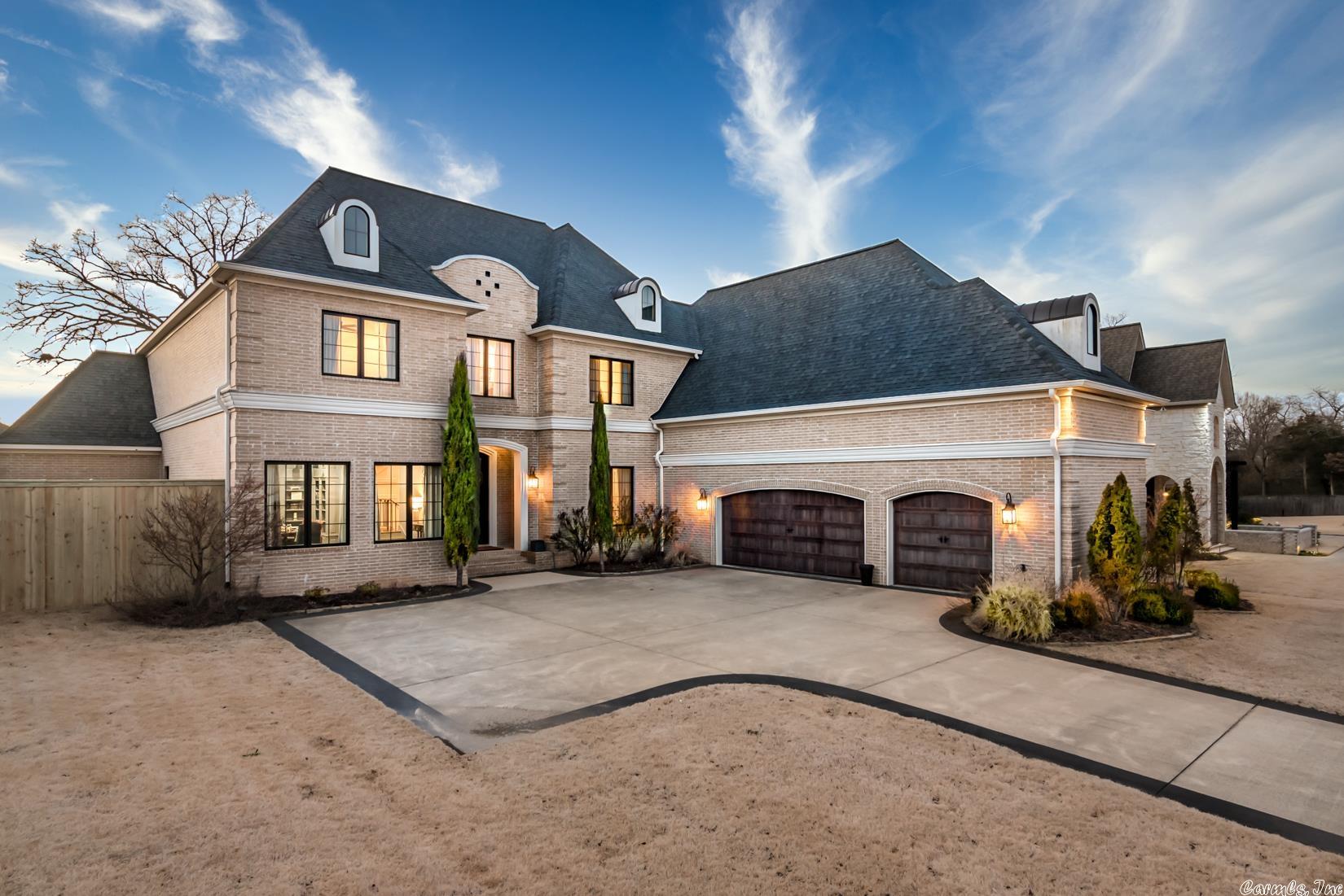 Welcome to this stunning luxury home with custom finishes nestled in the exclusive, gated neighborhood of Bella Rosa Estates.  Enter through iron doors into an incredible two-story foyer with byzantine ceiling, iron railing staircase and site finished hardwood floors. The great room opens to the gourmet kitchen featuring two spacious islands, a 48" Thermador Range with double ovens and griddle, new Quartz countertops and backsplash, touchless faucet and glass rinser. A secondary prep kitchen is located adjacent to the kitchen. The fabulous floor plan features four bedrooms all with en-suite bathrooms and large walk-in closets. Main level offers both primary and guest suite. The primary suite features access to the covered porch and luxury bathroom with soaking tub and large walk-in shower!  The second level features a media room with a full wet bar, ice maker, and surround sound. Spacious outdoor covered back porch with flat top grill, marble counters and outdoor fireplace with draperies and custom mantle. See agent remarks.