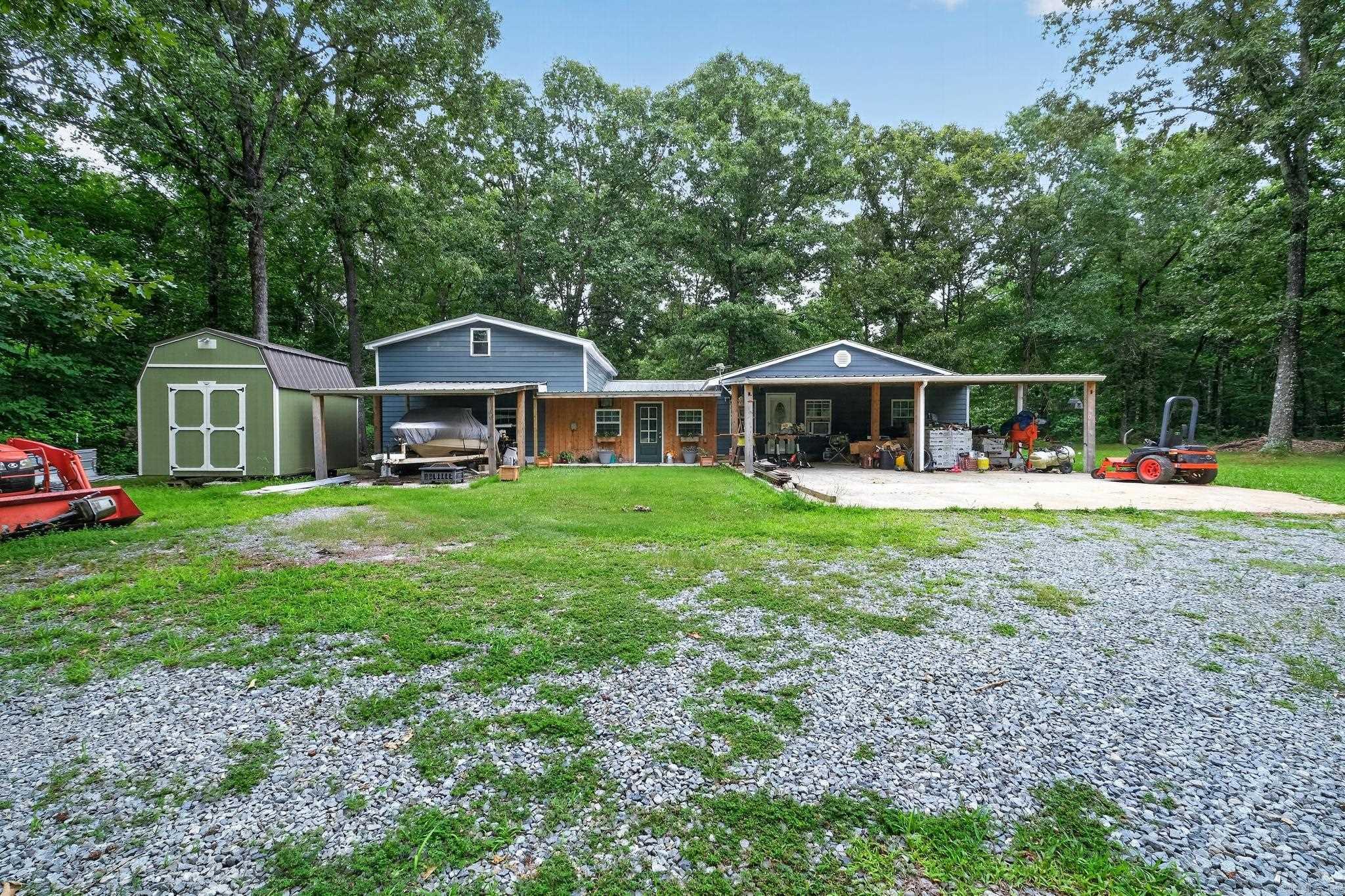 Discover the perfect blend of space, comfort, and privacy with this beautiful home situated on 3.05 acres. Offering over 1,800 square feet of living space, this property features 3 bedrooms and 2 bathrooms, providing plenty of room for family living and entertaining.  Inside, you'll find two spacious living areas, giving you flexibility for a family room, game room, or additional gathering space. A dedicated home office makes working from home convenient and comfortable. Relax year-round in the enclosed hot tub room, creating your own private retreat just steps away.  The expansive acreage offers endless possibilities for outdoor activities, gardening, pets, or simply enjoying the peaceful surroundings. With a desirable combination of indoor space and outdoor freedom, this property is ideal for those seeking country living while maintaining modern comforts.  Don't miss this opportunity to own a versatile property with room to live, work, and relax—all on over 3 acres!