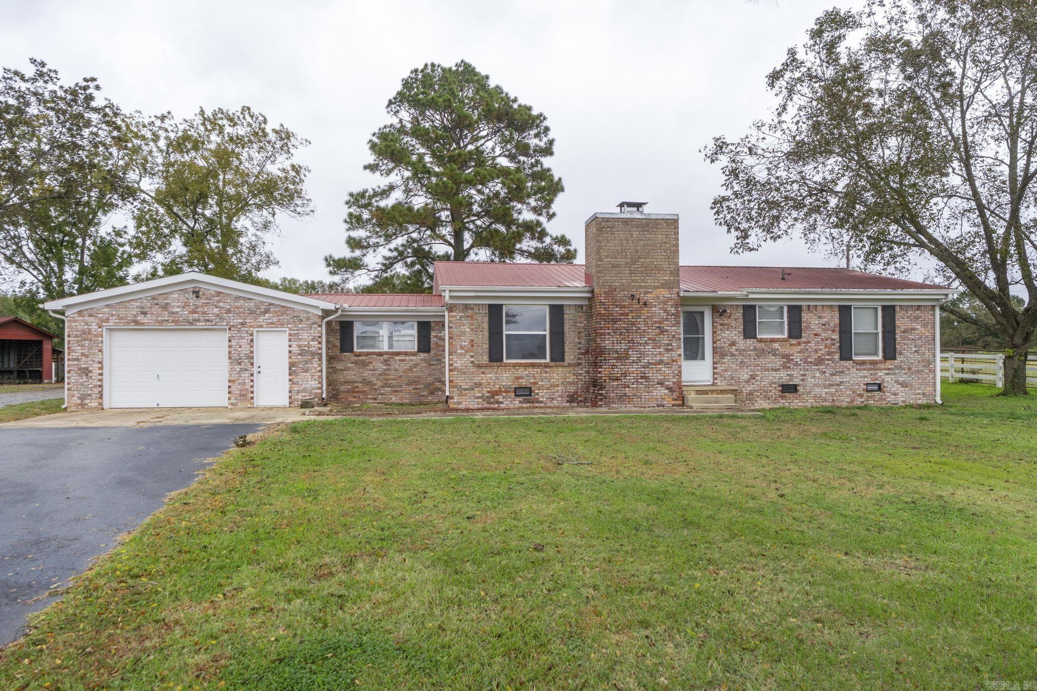 Welcome to this charming 2-bedroom, 1.5-bath, bonus room/formal dining,  all-brick farmhouse on approximately 1.12 acres. Enjoy serene country living with partially fenced acreage, covered parking/barn, and surrounded by farmland. Conveniently located just minutes from the interstate and Little Rock Air Force Base, this property offers the best of both worlds—peaceful rural surroundings with quick access to town. Don’t miss this opportunity to make it your own! Seller is installing new septic system. Assumable mortgage with an interest rate at 3.625%!!!