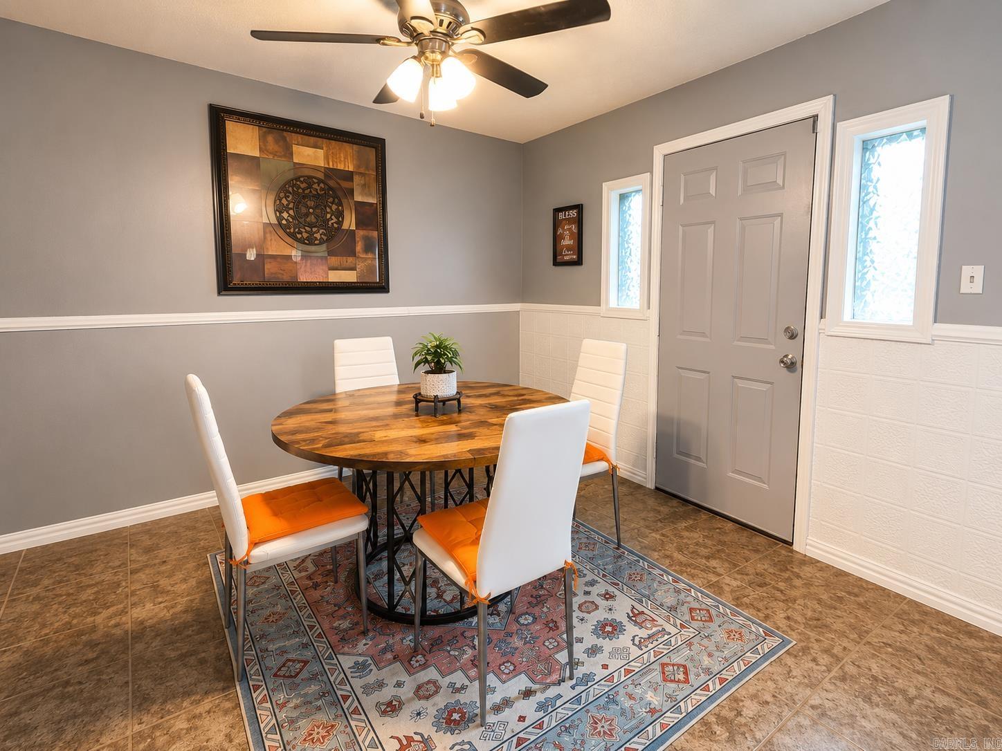 This home is a great starter home or investment property located in North Little Rock in the Meadowpark School district.  The home has been updated with fresh paint, and offers an enhanced with modern granite countertops, a built-in feature, a breakfast bar, matching wood cabinetry, a double sink, and full stainless steel appliances.  Layout includes a formal living room alongside a dedicated den and separate laundry utility area.  Offers a large, partially fenced green space ideal for tenants, pets, or outdoor entertaining