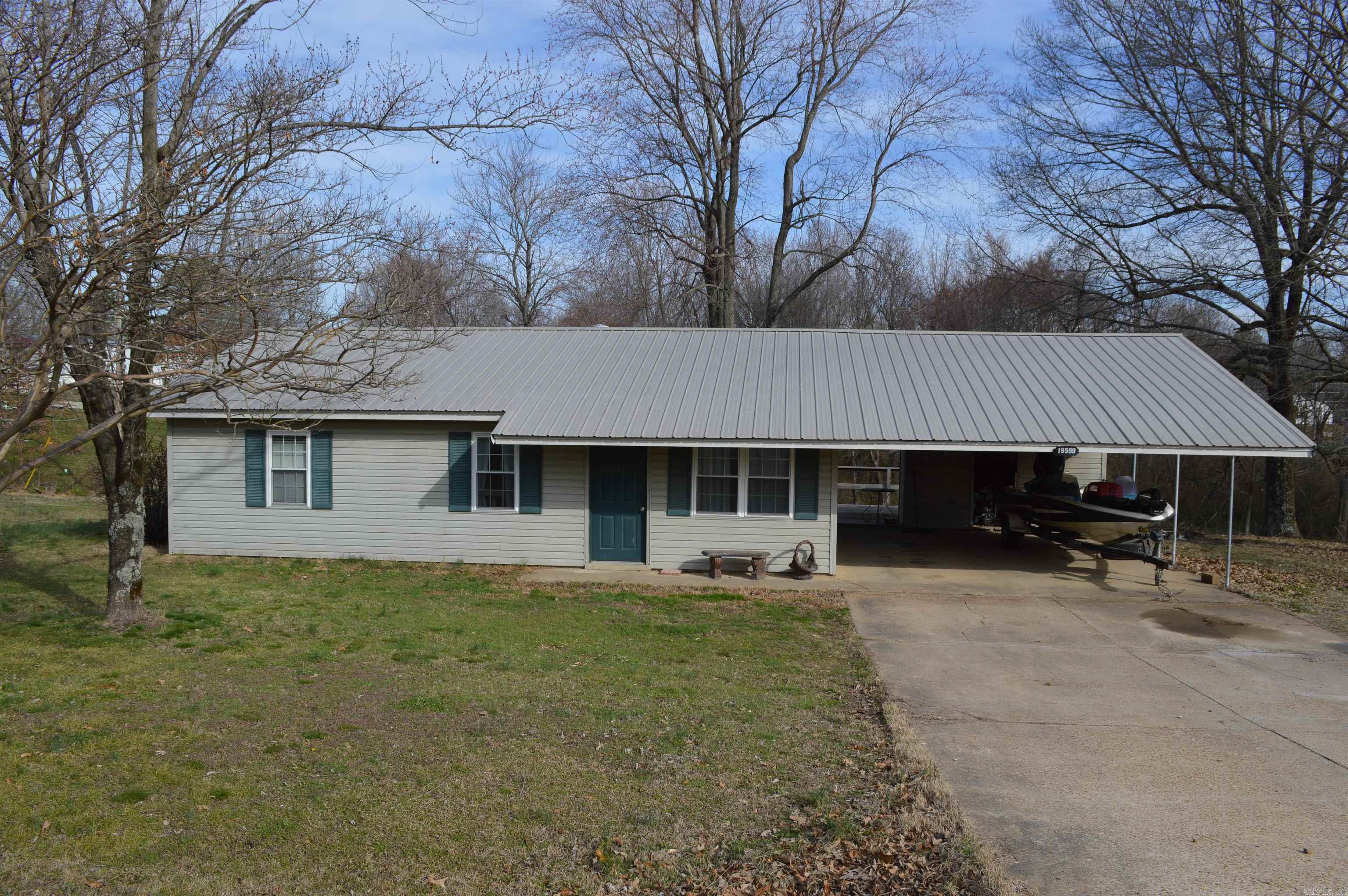 This roomy 2-bedroom home sit on a 0.63 acre lot just outside Harrisburg. Fresh interior paint, tile and hardwood flooring, kitchen appliances included, and HVAC less than 5 years old. Outside features a large backyard with raised deck, oversized two-car carport, and storage building. Metal roof, slab foundation, central cooling, and electric heat. Convenient location about half a mile from town and under 2 miles from Lake Poinsett State Parkcountry feel with quick access to schools, shopping, and recreation.