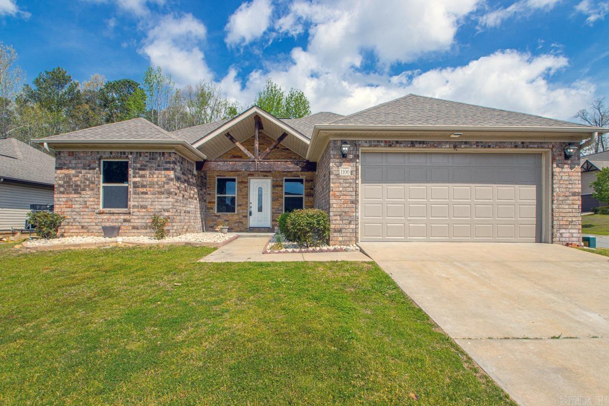 Absolutely stunning 3 bed 2 bath home on a prime corner lot in Bryant that checks every box buyers are looking for right now. From the moment you arrive, the curb appeal stands out with its maintenance-free exterior, rich brick and stone entry, and custom wood beam detail that frames the front door beautifully. Inside, the home feels elevated and completely refreshed with thoughtful updates throughout. New flooring, fresh paint, upgraded plumbing and electrical fixtures, quartz countertops, and stainless steel appliances all come together to create a clean, modern finish that feels far above the typical home. The added recessed lighting in the living room and kitchen brings in a bright, open feel that buyers immediately notice. The primary suite is a true retreat with double vanities, a separate tub and shower, and spacious split closets. Step outside to a private backyard with a covered patio, perfect for relaxing or entertaining. Homes with this level of finish, layout, and curb appeal don’t sit long in Bryant. Move-in ready, low maintenance, and dialed in where it matters… this one is going to get attention. New Roof May 2026.