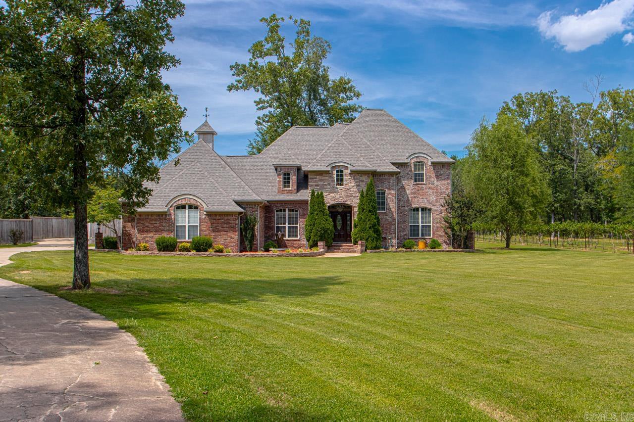 Dreams really do come true! Come see this custom "smart" home perfectly positioned on 3 beautiful acres! Enter into your new home to find a stunning two story foyer! Family room w/fireplace! Large dining room! Chef's dream kitchen! New Bosch dishwasher! New granite! Enough room for all the chefs in the family! Large Island! Double ovens! Etc! Etc! Master down! w/wonderful spa bath! Guest room w/en suite also down! Up~3 big bdrms or 2 w/bonus room! 3 car garage w/ 8X8 safe room! Over sized laundry room! Wait until you see the outdoor kitchen w/every single bell and whistle you have ever dreamed of! Big Crackerbarrel fireplace! Oh my!  Wait there is more... 20X40 inground pool w/slide! New liner! Outdoor shower! Wait there is more... 28 X 32 Bricked shop, heated & cooled! Finished out w/knotty pine walls! Floored attic above for storage! Separate driveway leads to shop! Wait there is more!! How about a Vineyard? A vineyard full of Petit Manseng grape vines! FABULOUS! New roofs 2023! New very expensive septic! Sprinkler system run from the well! Gazebo! Fountains! New Paint! On & On & On! Too much to list! You have to see it to believe it! Dreams really do come true!