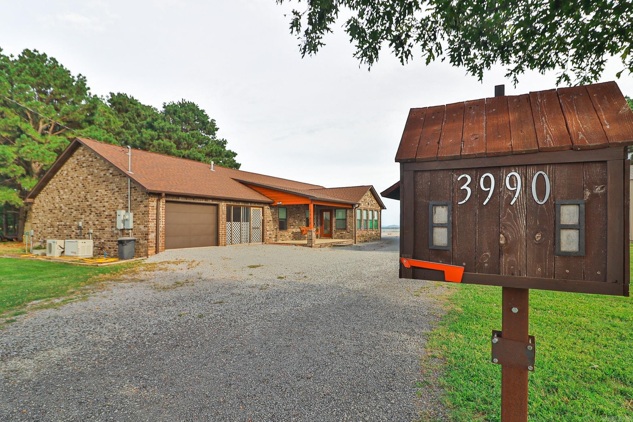 You do not want to miss this turn-key 3-bedroom, 2-bath single-family home on 0.98 acres with 1,977 sq ft of well-planned living space plus exceptional hobby/workspaces. The total heated and cooled spaces equal an impressive 2,800+/- sq ft. Inside, enjoy a bright layout with custom cabinets throughout by Keller Custom Finishing, two gas ranges, a relaxing primary suite/bathroom with a standup shower and a soaker tub, a sun/bonus room, and easy-care windows that fold out for cleaning. The third bedroom is also a dedicated concrete safe room easing your mind during severe weather. Modern comforts include a 22kw Generac whole-house generator and a security system.  Car enthusiasts and hobbyists alike will love the oversized, heated and cooled garage which offers a commercial sink, cabinets, and a gas stove. Outside, an 8x10 storage shed adds convenience. The 30x50 insulated shop is also heated and cooled and features 3-phase power, 14 ft walls, a dedicated 250-gallon septic system, an office, a bathroom, work benches, catwalk storage, and pegboard organization ideal for serious projects or a small business. A rare blend of comfort, safety, and true utility ready to move in and get to