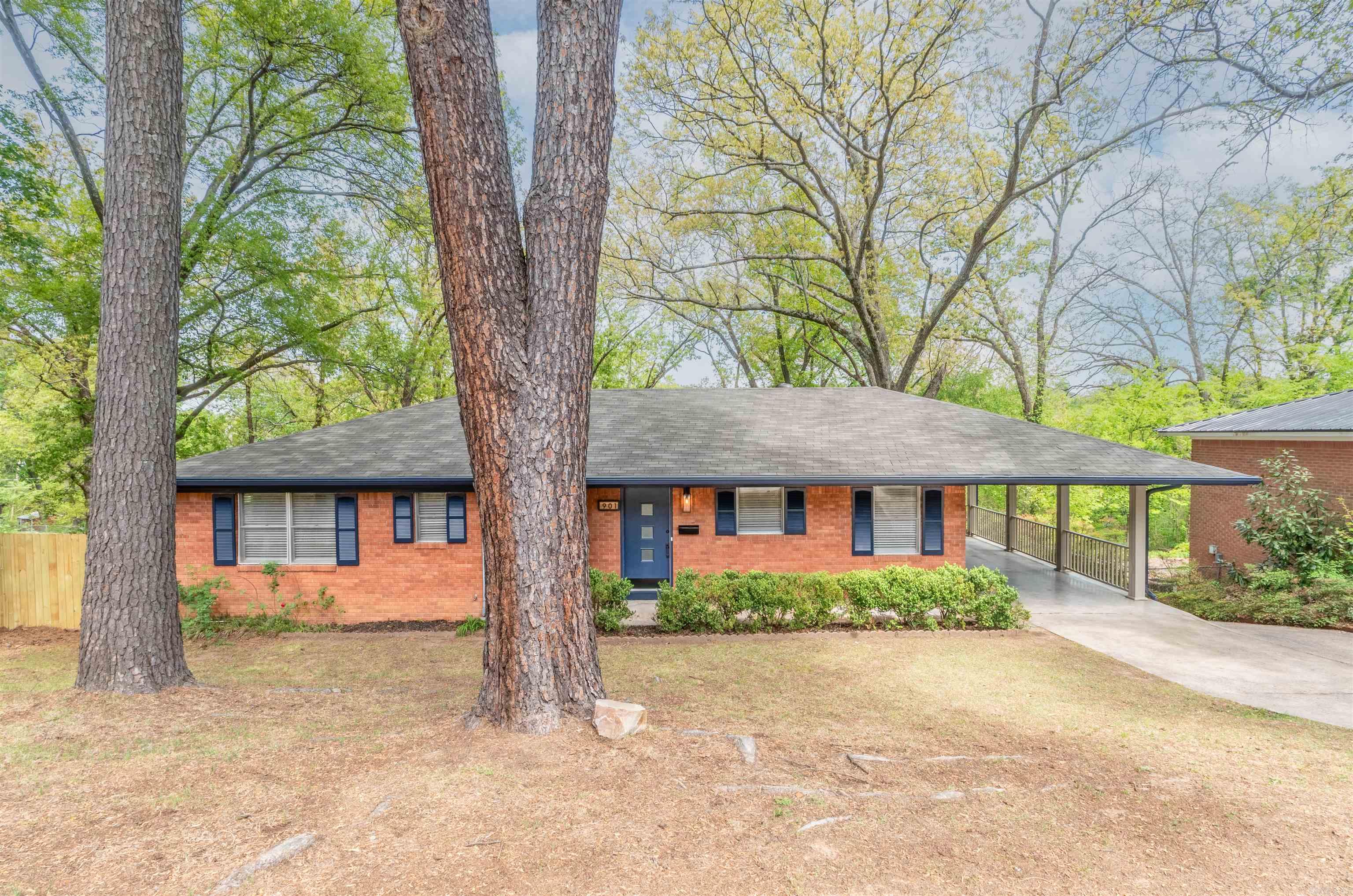 Welcome to this beautifully updated 5-bedroom, 3-bath traditional home in the highly desirable Park Hill area of North Little Rock. Nestled on a spacious lot within walking distance to The Ole Mill, this home offers timeless charm with stylish modern upgrades throughout. Inside, you’re greeted by a bright and open living space featuring gorgeous hardwood floors and a stunning custom fireplace accent wall that serves as the heart of the home. The fully renovated kitchen is a standout, boasting sleek marble countertops, a farmhouse sink, stainless steel appliances, designer backsplash, and custom cabinetry. Thoughtful touches like modern fixtures and a pot filler elevate both style and functionality. Just beyond, a cozy built-in nook offers the perfect space for a breakfast area or reading retreat. With five spacious bedrooms and three full bathrooms, this home provides flexibility for growing families, guests, or even a separate space for adult children or mother-in-law. Each bathroom has been tastefully updated with contemporary finishes. This move-in ready home perfectly blends classic character with modern updates—don’t miss your chance to make it yours!