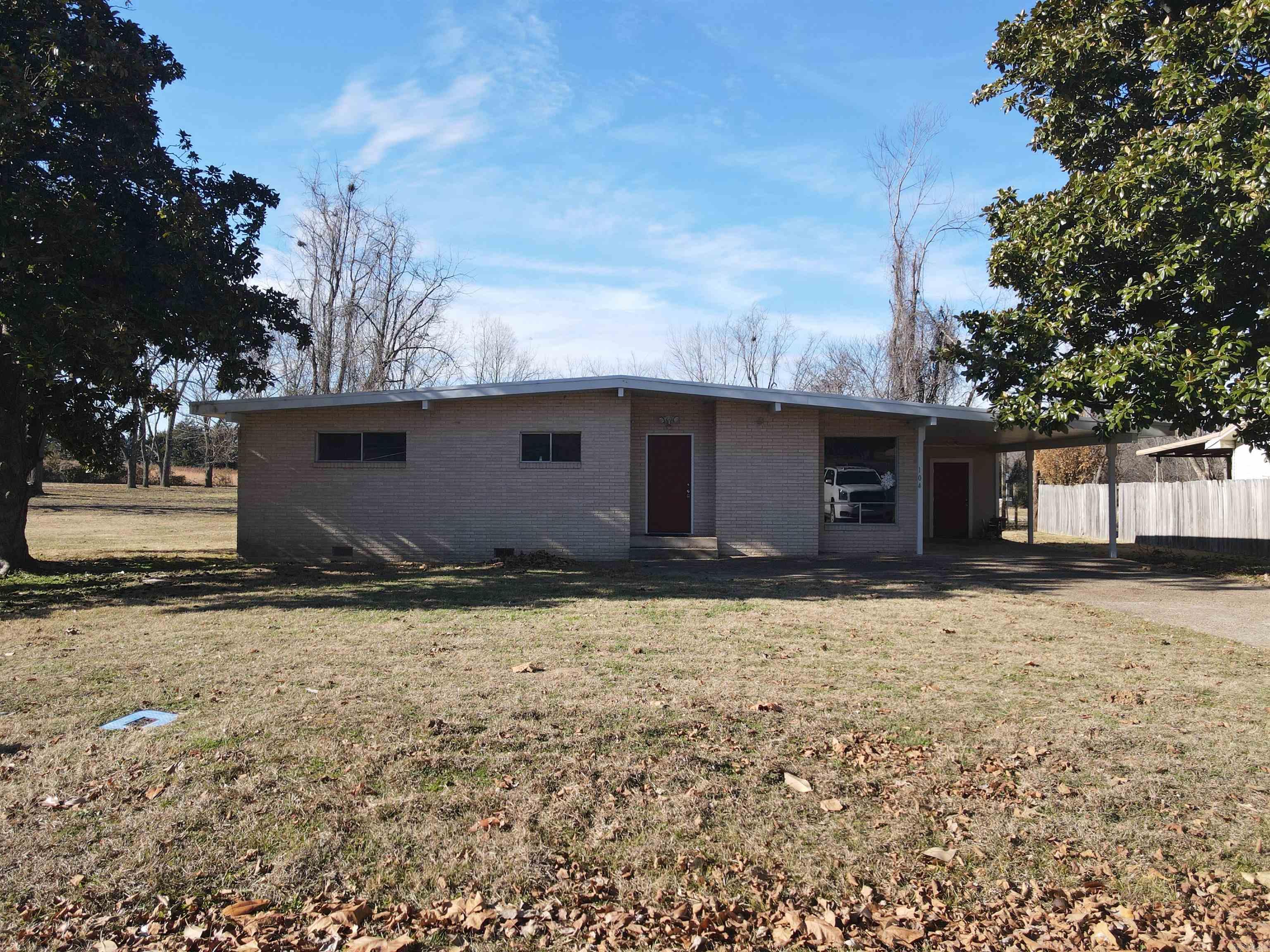 Introducing a captivating new listing within the city limits of Marshall, Arkansas. Nestled on a generous 2-acre+/- property, this charming home boasts a tranquil ambiance and offers immense potential for those seeking a contemporary living experience.  Step inside and discover a thoughtfully designed interior featuring 3 bedrooms and 1 bathroom. With a touch of modern flair, the home would be a wonderful starter home or rental investment property.  The spacious, level yard surrounding the property presents endless possibilities, whether you envision cultivating a flourishing garden or hosting delightful outdoor gatherings.  Convenience is at your fingertips with a covered carport, providing sheltered parking for your vehicle, and a convenient storage room attached to the carport, offering a practical solution for storing your belongings. While this property requires some work to reach its full potential, envision the possibilities and let your creativity flourish. Embrace the opportunity to customize this space into your dream home, tailoring it to your unique taste and style. Seize this chance to own a slice of tranquility in Marshall, Arkansas.