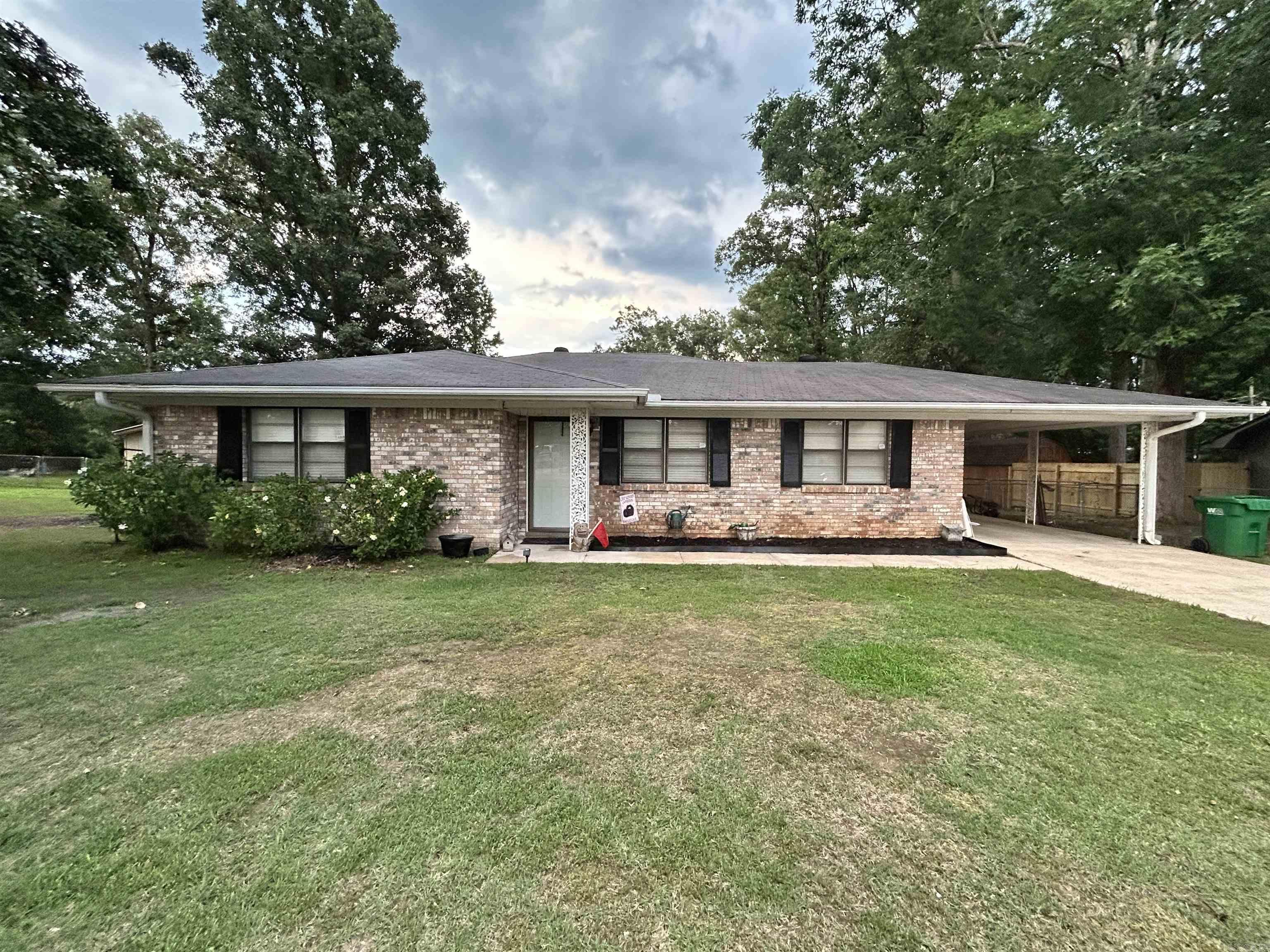 Located in the White Hall School District, this well-maintained home offers updates, storage, and outdoor space you'll appreciate! The kitchen features a newer remodel with granite countertops and a stainless-steel sink, while newer flooring adds a fresh feel throughout much of the home. Appliances in kitchen STAY. Inside, you'll find an abundance of storage, including built-ins, a pantry, and an impressive three closets in the primary bedroom. Outside, enjoy a fenced backyard, two storage sheds, a storage room under the carport, and additional gravel parking space alongside the driveway for extra vehicles, trailers, or guests. The custom doghouse can remain with an acceptable offer. Don't miss the opportunity to see all this property has to offer! SEE AGENT REMARKS
