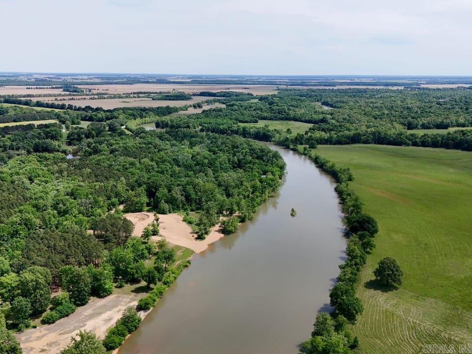 Take a look at this rare opportunity to own your own piece of real estate paradise on Current River! This 3.74 +/- acre property boasts a 2670 +/- 3 bedroom 2 bathroom log cabin style home, two detached shops with concrete floors, and a PRIVATE boat ramp! The property sits just 12 minutes south of Doniphan, Missouri, just seconds across the Arkansas state line. No long gravel roads to access this home as it sits approximately 1/4 mile off of the highway down a short well-maintained gravel driveway. This home is currently listed on Vrbo and has an established yearly income with no limit on it's potential. If you know anything about Current River, you know how hard it is to find a property like this that truly checks all the boxes. Approximately 43 minutes to Poplar Bluff Missouri, call today and make it yours!