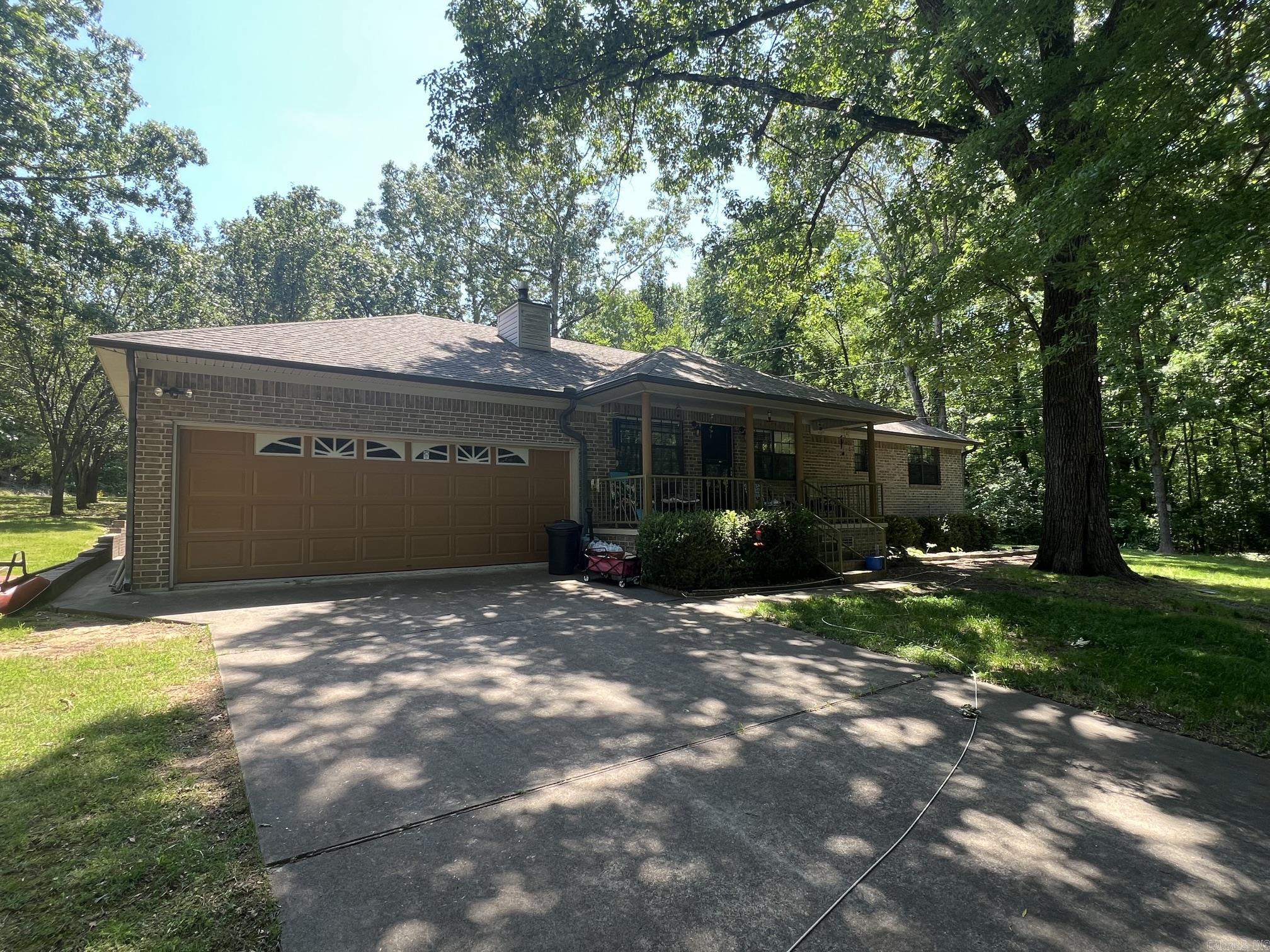 Well Maintained Brick Home Sitting on Almost a acre of land. Private quiet setting Across the street from the Harris Brake Lake. Lake View Home features include 2 bedrooms and 2 bathrooms.  Open floor plan between the kitchen and living areas. Two car garage. Extensive landscaping and Mature trees on the lot