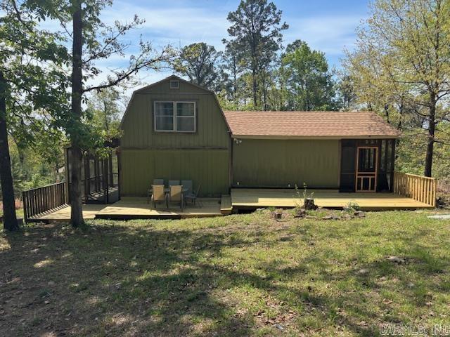 Welcome home to peace and quiet in the woods so close to Greers Ferry Lake there is a small view of it with lake/boat access at Devil's Fork Park nearby.  It sits on two lots of just over an acre total, lots of surrounding wooded areas and trees, has a covered metal parking canopy, and a Dersken storage building that was added in 2020.  There are two spacious bedrooms and two full baths, a nice eat-in kitchen with butcher block island, and the current owners are currently using the downstairs/primary bedroom as a living area.  The woodwork in this one is very nice, there are two screened in porches at either end of it, and there is a separate laundry room off of the back screened in porch as well.  Fiber at the street was added in 2025, city water access added in 2020, the home was repiped with pex in 2025, 3 mini split units were added in 2024, a new architectural shingle roof was installed in 2023, just prior to listing in 2026 all of the front decking and underpinning was redone, and the fridge, washer, dryer, and all remaining furniture convey.  Whether you're looking for a new place to call home or a place to get away, this one at this price point is not to be missed!!!