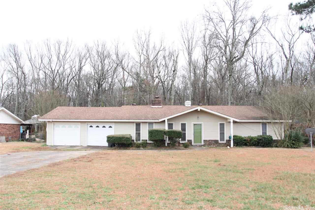 Great home with many updates.  Sitting on almost an acre of land close to everything.  New laminate flooring in living area, beautiful deck with separate hot tub enclosure.  New kitchen cabinets with granite counter tops.  Two car garage with plenty of storage plus extra storage building in back yard.  Taxes do not include homestead credit