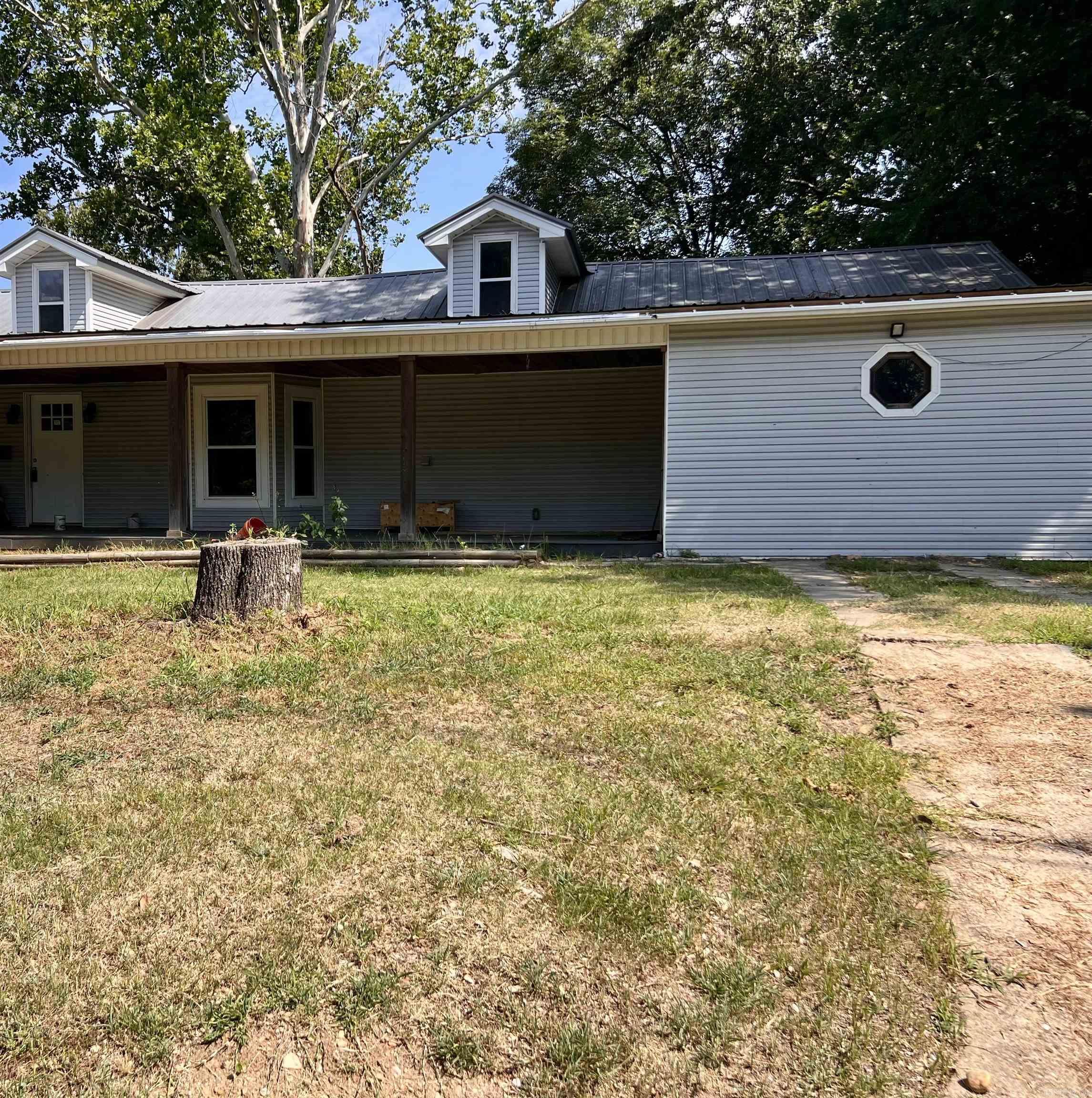 Check out this 3 bed, 2 bath 1.5 story home sitting on two lots situated in the heart of downtown Benton! At 2409 sq ft you have enough room to spread out and enjoy the area. Big beautiful covered front porch to sit and enjoy your coffee. Each of the bedrooms has a cedar closet and are all on the main floor. Original hardwood floors. Washer, dryer, and commercial grade refrigerator convey with home.