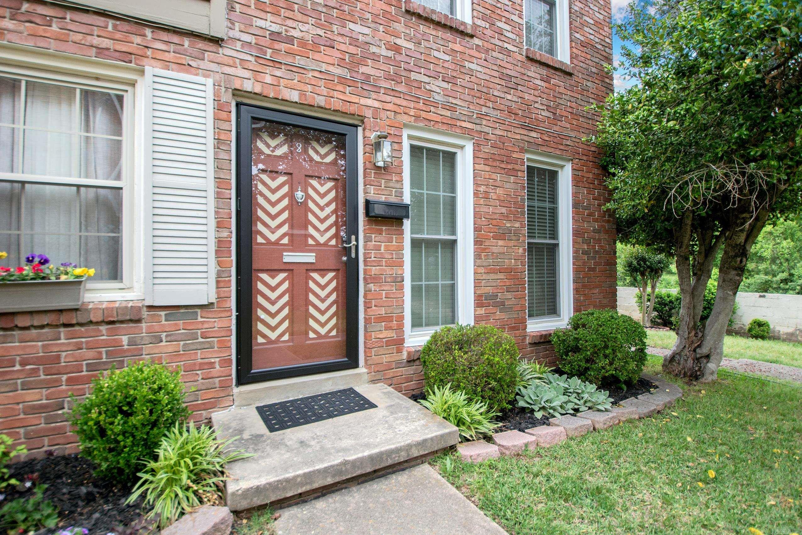 Brick condo complex conveniently located off Rodney Parham Road.  Main level has spacious living room, kitchen with granite countertop and a half bath.  Two large bedrooms and a full bath upstairs.  Inviting private patio off the kitchen with a separate room for the washer and dryer and storage. This condo is an end unit giving you easy walk around access.  Condo fee covers water, grounds, roof, gas, water, and termite policy.