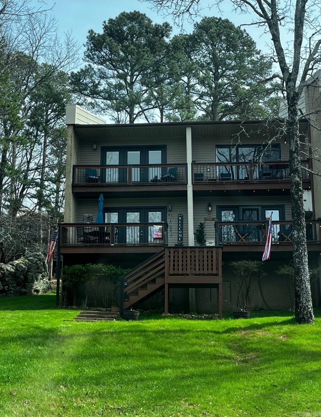 This condo is just 3 mins from the cool pool nestled in the heart of a lake town resort community, this turn-key 2-bedroom, 1.5-bath condo is your gateway to year-round adventure and relaxation. Perfectly updated & ready for immediate enjoyment, it includes everything you need furnished down to the linens and dishes minus just a few cherished personal items. Step inside to gleaming new luxury vinyl plank floors that flow seamlessly throughout, complemented by fresh paint in soothing neutrals that amplify the natural light pouring through updated windows. The kitchen shines with brand-new appliances, countertops & trendy shelving for effortless entertaining. Cozy up, living area with plush new decor, or retreat to the spacious primary bedroom. The second bedroom offers versatility as a guest room or home office, while the full bath features modern fixtures and ample storage. Outside, vibrant green grass blankets the front and back yards, creating an inviting oasis. Unwind in the charming front porch sitting area with morning coffee, or enjoy grilling steps from the kitchen area, or head upstairs to the private balcony for sunset views . The upper deck beckons for sunset views as