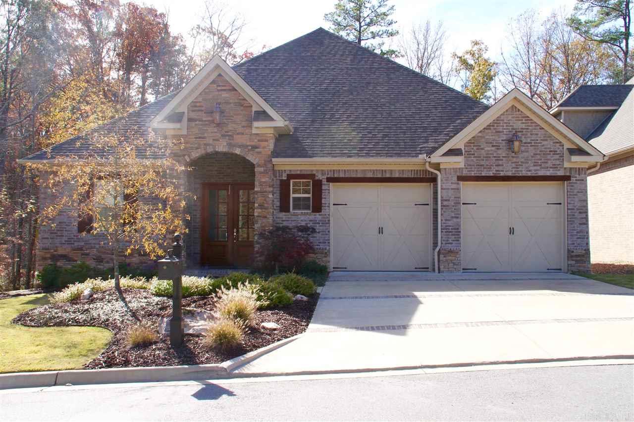 Beautiful one-level patio home in The Woods, a gated community of Woodlands Edge.  Stunning open floor plan has large great room w/ fireplace, dining area & kitchen built for a chef w/ pantry.  Many extras: separate office, Maple site-finished floors, Pella windows & doors, granite countertops, central vac system, surround sound, alarm, abundance of storage built-in, stairs to floored attic storage & great closets.  Private, large deck overlooks green space w/ built in grill area. Yard is maintenance-free.