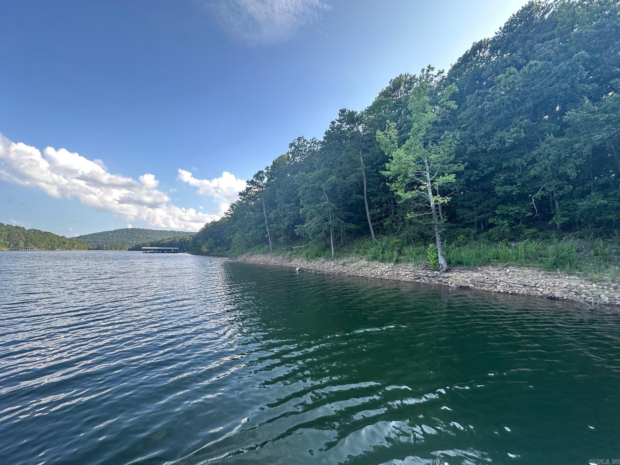 LAKEFRONT LOT WITH EASY WALK TO THE WATER  This beautiful tree covered lot i ready for your new build. Located in the beautiful Cobalt Bay Subdivision, This lot has Electricity, Water and Fiber to the lot.