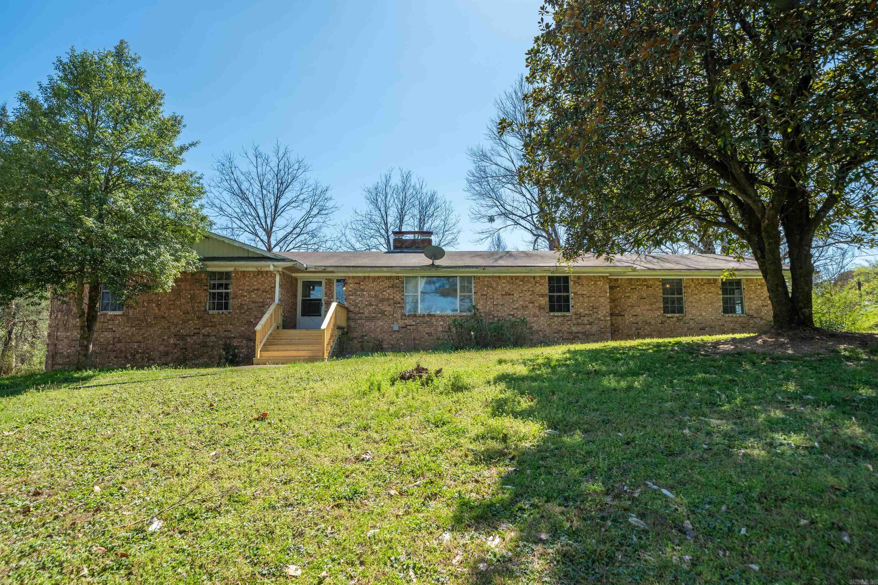 Spacious fixer-upper with incredible potential! This large home offers plenty of room to bring your vision to life. Featuring a large unfinished basement the possibilities are endless.  Create a game room, workshop, extra living spaces, storage area, or all of the above. Inside, you'll find 2 large living rooms, a spacious bonus room just off of the kitchen, providing flexible space for entertaining, good size bedrooms, and much more! Situated on over 2 acres, this property offers a generous yard and a great location close to everything. With some work and updates, this property could truly shine!