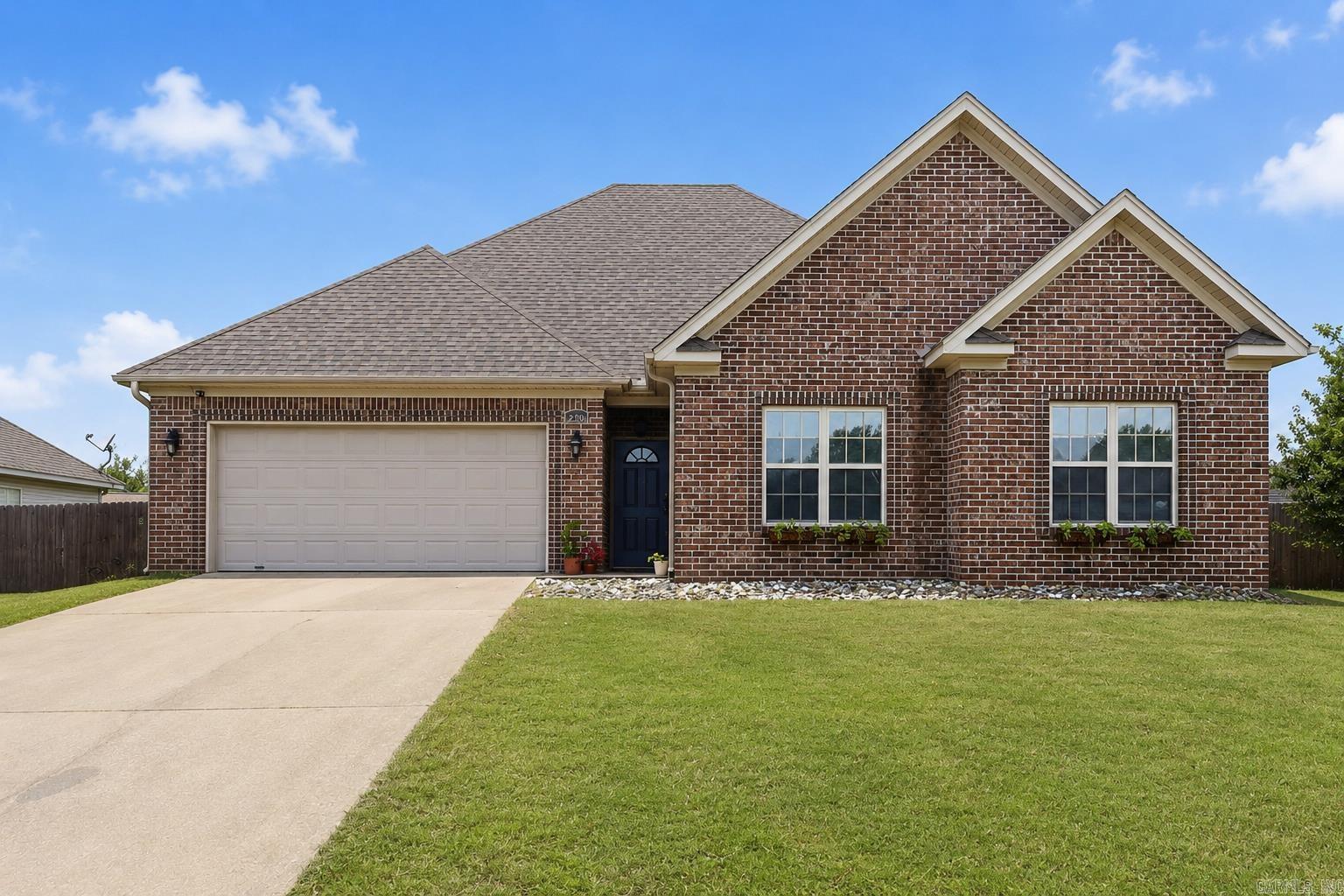 Move-in ready and thoughtfully designed, this 3-bedroom, 2.5-bath home offers features that are hard to find at this price point, including a rare half bath for guests. The spacious living room showcases soaring cathedral ceilings, creating an open, airy feel, while the primary suite features a tray ceiling and an oversized bath with dual sinks, a walk-in shower, soaking tub, and generous walk-in closet. No carpet throughout makes for easy maintenance, and the roof was replaced within the last two years for added peace of mind. Step outside to enjoy the covered patio and fully fenced backyard, perfect for pets, play, or entertaining. Conveniently located in Benton near schools, Target, HomeGoods, restaurants, and everyday shopping, with quick interstate access for an easy commute to Little Rock. Whether you're buying your first home, downsizing, or simply looking for a low-maintenance, move-in ready property, this one is ready to welcome you home.