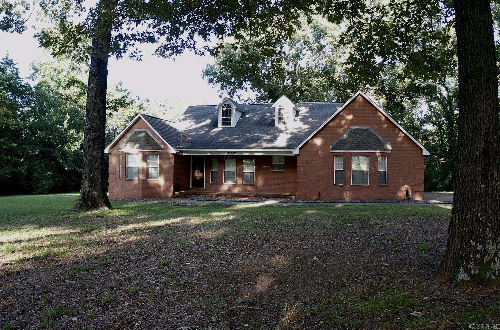 Welcome to 2195 Hwy 267 S in Searcy! Situated just outside the city limits, this 3-bedroom, 2-bath home offers the perfect balance of peaceful country living and everyday convenience. With 1,867 square feet of living space on 7.1 beautiful acres shaded by mature oak trees, this property provides privacy, room to roam, and endless possibilities. Located just minutes from Searcy's shopping, restaurants, schools, and other amenities, you'll enjoy the best of both worlds. The home sits approximately 2 acres off the highway, creating a secluded setting while leaving excellent potential for future development possibilities. With room to expand, the remaining acreage among the mature oaks could offer flexibility for additional improvements, making this property attractive for homeowners, investors, or developers alike. Whether you're looking for a private homestead, acreage close to town, or a property with investment potential, this is one you won't want to miss. Schedule your showing today!