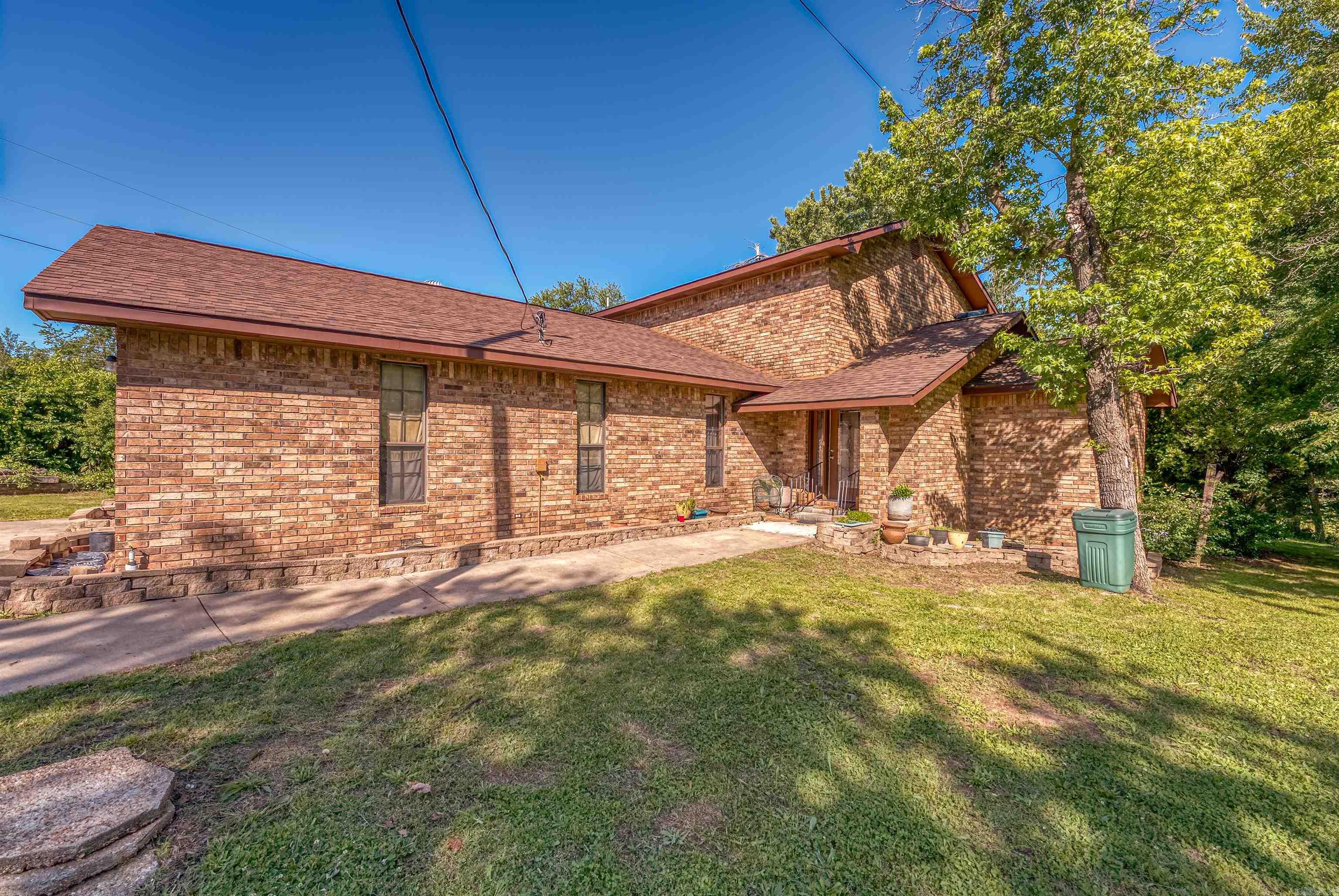 PRICE ADJUSTMENT AND INCENTIVE! HOME ONLY! Seller Motivated! The Seller will give $20,000 at closing to be used for closing costs, lender’s fees, rate buy down or repair allowance for any Contract that can close by September 1, 2025. Charming 3,200 sq ft brick home on 2 unrestricted acres just outside Marshall, AR. Features a hand-forged iron spiral staircase leading to two upstairs master suites with tiled en suites. Main floor includes a third master with private access to hall bath and pool patio, with two additional bedrooms, and an office/study down the hall. The kitchen has tile flooring, oak cabinets, and a breakfast bar overlooking the dining area with access to the back deck. Enjoy a cozy sunken living room off the foyer. Outside, there’s a large in-ground pool (needs TLC) There is plenty of room for gardening or animals, no restrictions. Located at the corner of Hwy 27 & Barren Hollow Rd, just 3.5 miles from Marshall, just minutes to several Buffalo River access points, & 1 hr 45 mins to Branson, MO. A rare blend of space, charm, and functionality in the Ozarks!