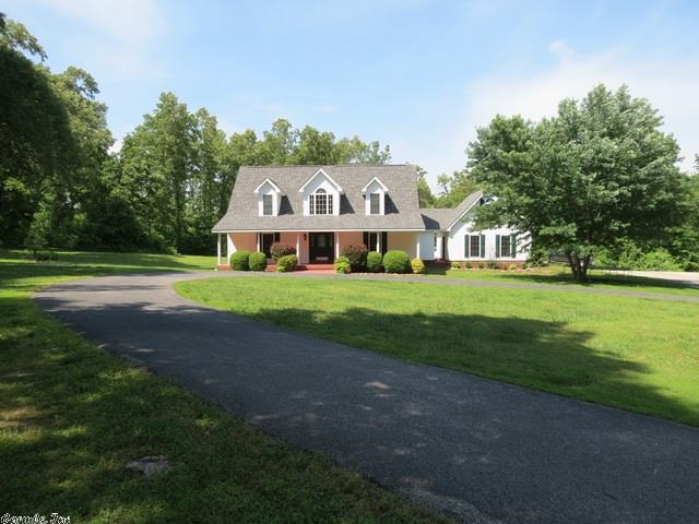Super curb appeal for this colonial style home on 5 ac m/l.  Could be a 4 bedroom home if Bonus room over garage was converted.  Breakfast room and formal dinning room.  Living room looks out at kidney shaped swimming pool with a slide.  Large master bath. Very private yet minutes to town or the White River. Executive style setting. Additional 30X30 detached shop for all the toys.  Horses allowed.