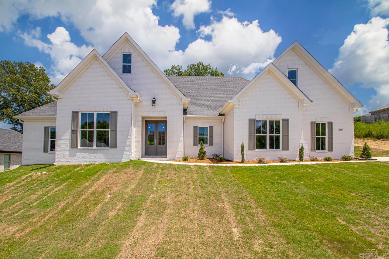 Welcome to the highly sought-after Coldwater Creek subdivision! This stunning new construction home offers 5 spacious bedrooms (or 4 with bonus), & 3.5 baths on a generous almost half-acre lot. The moment you step inside, you’re greeted by a warm & inviting living area featuring a cast stone surround gas log fireplace, built-ins with open shelving, & gorgeous LVP flooring. The chef’s kitchen boasts ample cabinetry, sleek countertops, stainless appliances, soft-close drawers, hidden pantry, & a gas range. The open dining area is perfect for gatherings. The primary suite features vaulted ceilings, a spa-like bath with a large walk-in shower, soaker tub, & a massive closet. This split floor plan includes 3 additional bedrooms w walk-in closets & a shared bath with double vanities & private toilet/shower. Guests will love the extra half bath conveniently located downstairs. The spacious laundry room includes storage, counter space, & a sink. Upstairs you’ll find a large bonus room & full bath, perfect for a playroom, bedroom, or for guests. Enjoy the peaceful green space from your covered back patio!
