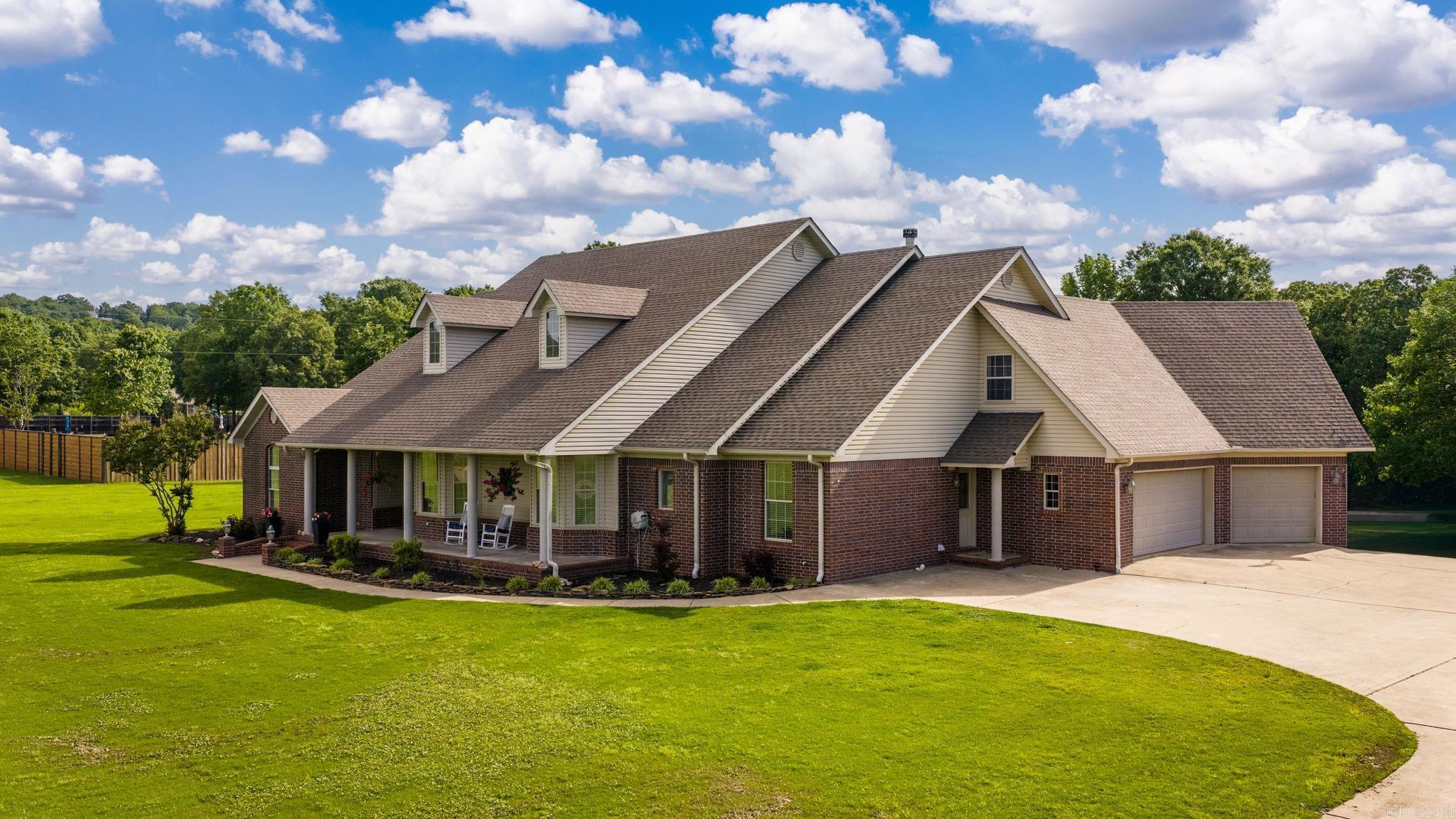 WANT IT ALL IN CONWAY?  Large Home with 3-Car Garage and Safe Room, almost 5 Acres, Stocked Fishing Pond and a 30x40 Shop, just outside of Conway City Limits. This home has it all. This home features 4 bedrooms and 3 bathrooms, plus an office and 2 living areas downstairs and a large game room/5th Bedroom upstairs. Built for efficiency and strength with 2x6 exterior walls and insulation in the exterior and interior walls. The expansive back porch is covered with a vented grill area and TV that overlooked the massive back yard and pond that is stocked with fish.  The roof and both A/C Units have been replaced in the last 5 years and there's nearly enough concrete on the driveway to land a plane. There is storage space for all your toys, room for the family and a porch and yard for all your friends.  Don't miss this one!