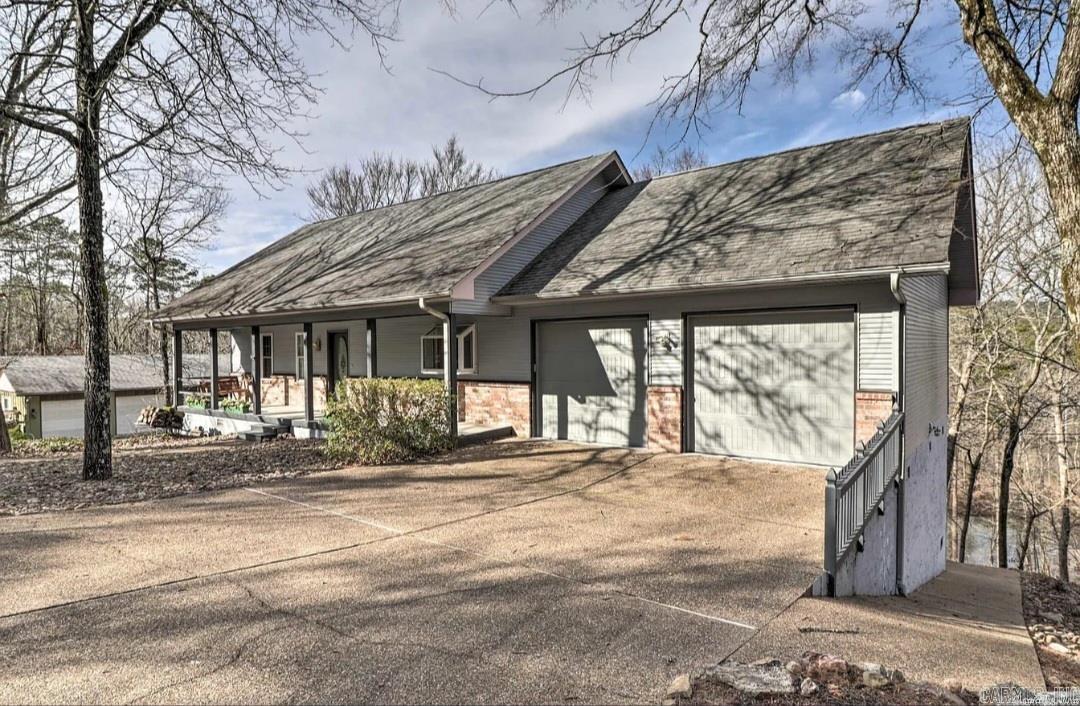 Enjoy waterfront living on beautiful Lake Coronado! This 3-bedroom, 2.5-bath home offers approximately 2,476 sq ft of living space on a 0.47-acre lot with a private dock and stunning lake views. Features include vaulted ceilings, warm wood accents, a main-level primary suite, multiple living areas, and a 2-car garage. Conveniently located near Coronado Golf Course, fitness facilities, walking trails, and all the amenities of Hot Springs Village. Ideal as a full-time residence, vacation retreat, or investment property. ?????