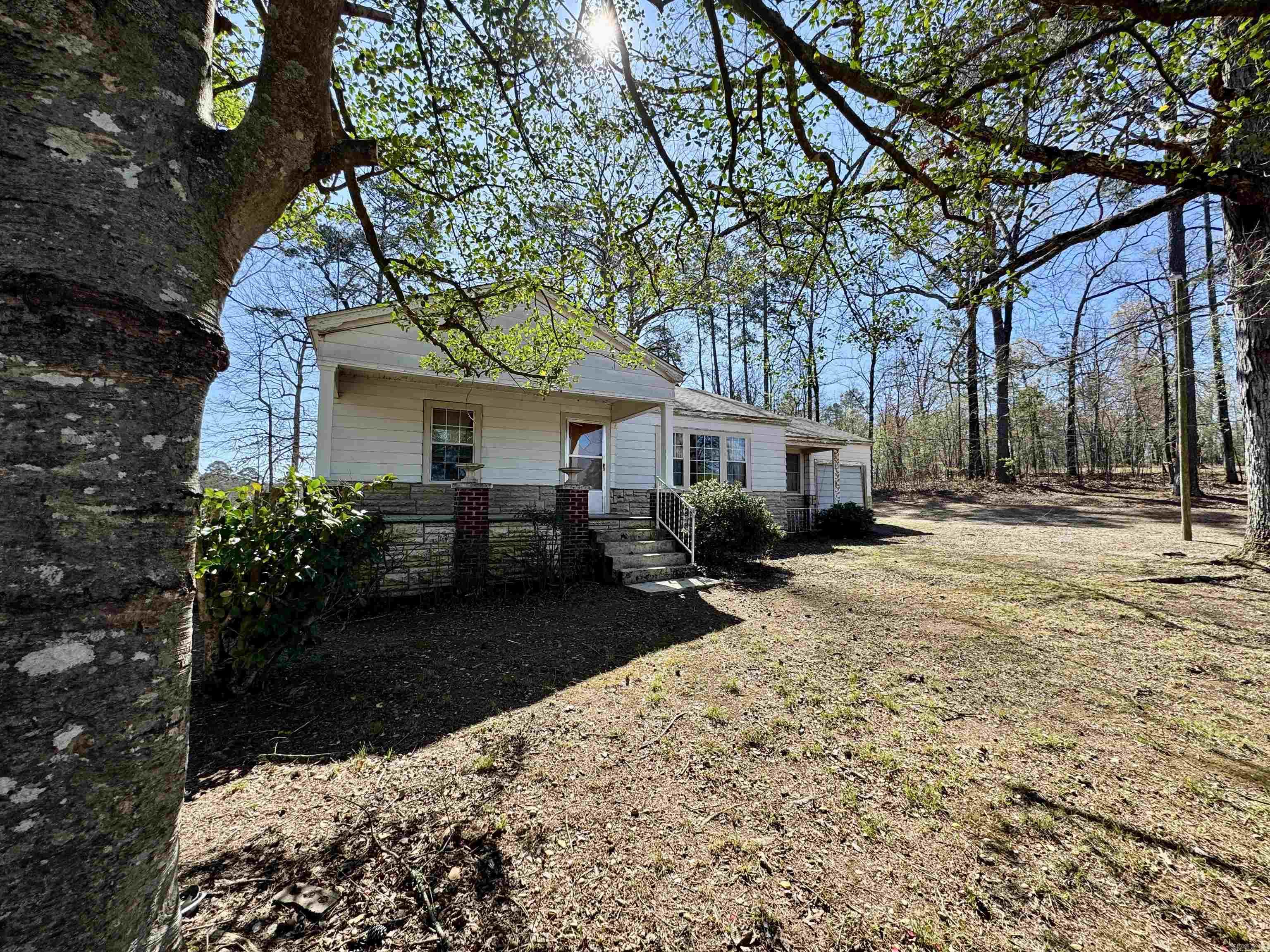 Looking for the affordable home outside of town?  Here it is.  This property has a 3 bedroom 1 bath home with 20 x 28 shop building with additional electric for large machinery.  Home offers original hardwood floors, LARGE front porch, very clean storm cellar.  This property has room and within 10 minutes of town.   Agents see Agent Remarks for Legal