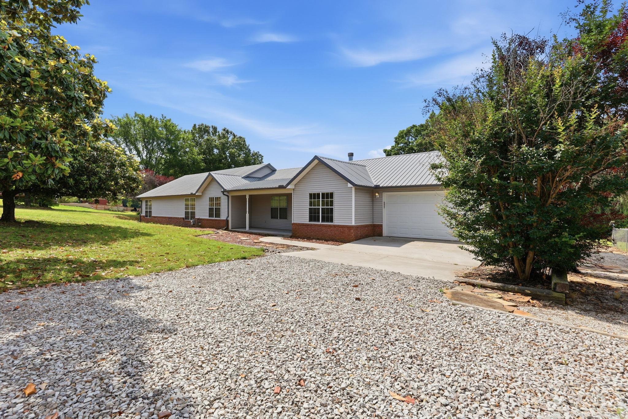 Escape to the peace and privacy of country living with this beautifully updated 5-bedroom, 3.5-bath home situated on 2.47 scenic acres. Designed with both comfort and entertaining in mind, this property features a sparkling pool, expansive outdoor living space, and a stunning back patio perfect for hosting family and friends year-round. Inside, you’ll find stylish butcher block countertops, 2 en-suites, a modern backsplash, updated kitchen appliances- refrigerator conveys!  Major system updates provide peace of mind, including a 50-year durable metal roof (2017), dual HVAC systems (2020), pool liner and robotic pool vacuum cleaner. Need extra space? The 30x60 shop is pre-wired for electricity and offers endless possibilities for hobbies, storage, equipment, or workspace needs. Extensive landscaping enhances the property’s curb appeal. Did I mention EVERYTHING IN THE SHOP STAYS--high value items guaranteed to help you as a homeowner. Reach out directly for photos, access available to shop with accepted offer.