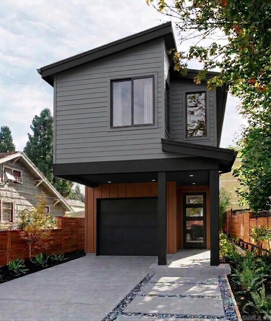 Welcome to 1516 S. Ringo Street — a stunning new construction home where modern design meets everyday livability in one of Little Rock’s most sought-after in-town locations. This 3-bedroom, 2.5-bath home offers 1,387 heated and cooled square feet spread across two beautifully finished levels, thoughtfully designed for the way people actually live. The main level features soaring 9-foot ceilings, an open-concept great room, and a well-appointed kitchen with room for a full refrigerator, dishwasher, and your vision for the perfect finish package. Natural light pours in through oversized windows, and the clean-lined modern exterior makes a statement from the street. Upstairs, retreat to a spacious master suite with a private 5-foot tub/shower combo and walk-in closet. Two additional bedrooms share a full bath, with a convenient half bath on the main level for guests. Every inch of this home has been designed with intention — no wasted space, no builder-grade afterthoughts. Additional highlights include a 1-car garage with 9-foot ceilings, a thoughtful roof plan with classic 5:12 pitch, and quality construction by EY Custom Homes. New construction. Builder warranty included.