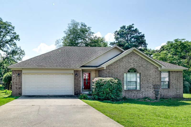 Great layout with super nice yard.  Elegant entrance leads to large living area with hardwood floors.  Kitchen has tons of counter space, cabinets and refrigerator too!  Large master bedroom and bathroom with double vanities AND a huge walk in closet.  You'll love the spacious spare bedrooms too!  Oversized backyard features nice tiered deck...perfect for entertaining!  Refrigerator, washer and dryer stay! New Heat/Air in 2012. Seller will install new carpet in bedrooms with acceptable offer (up to $1600).