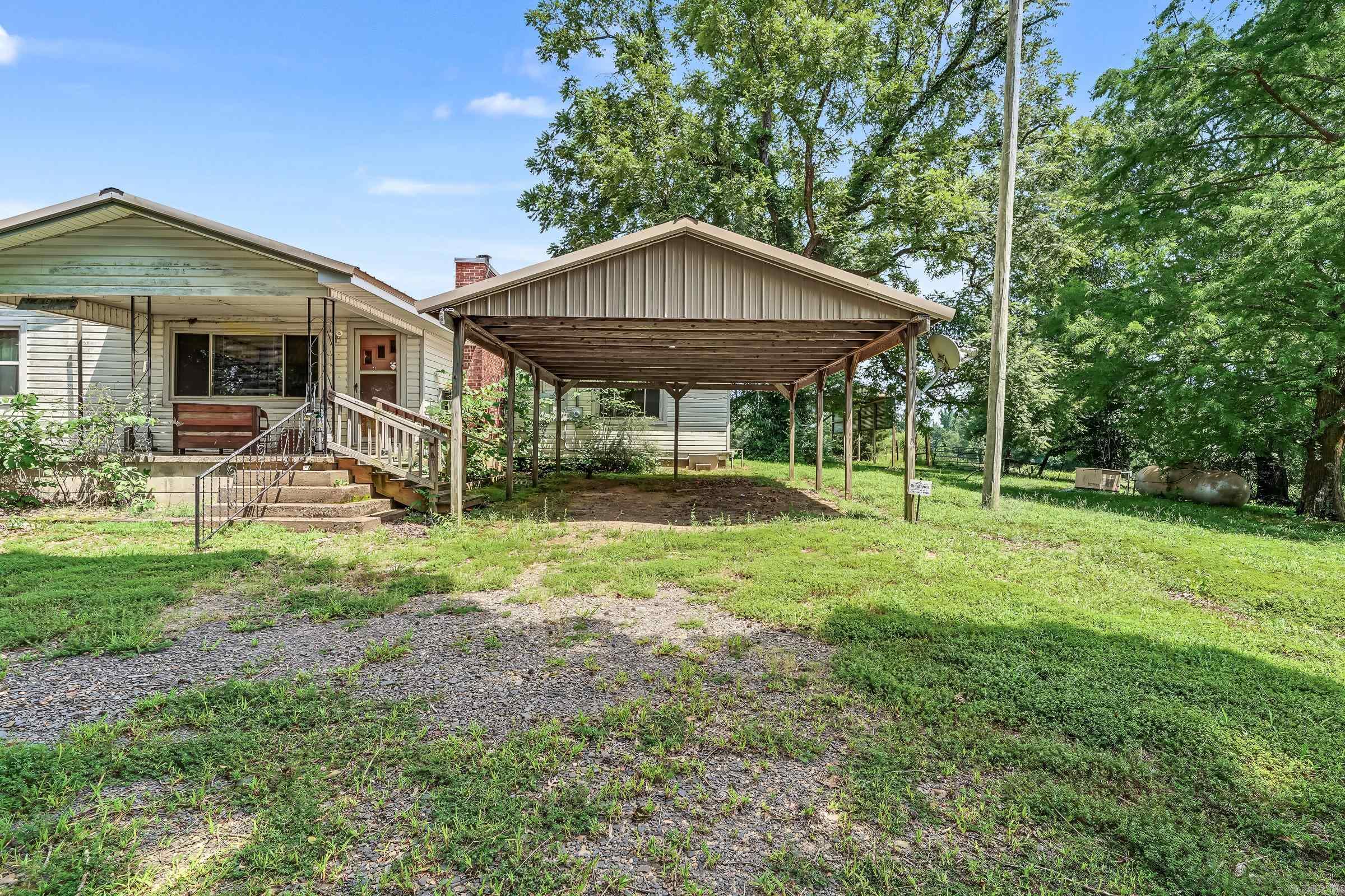 Welcome to country living this property is only 3.5 miles from town and sits on 21.06 acres. On this property there is 2 ponds a walk in storm cellar and a Generac home generator. The house has 3 bedrooms and 2 baths with a wood pellet fireplace insert. There is also one standing old 32x375 foot chicken house that's currently being used for hay storage.