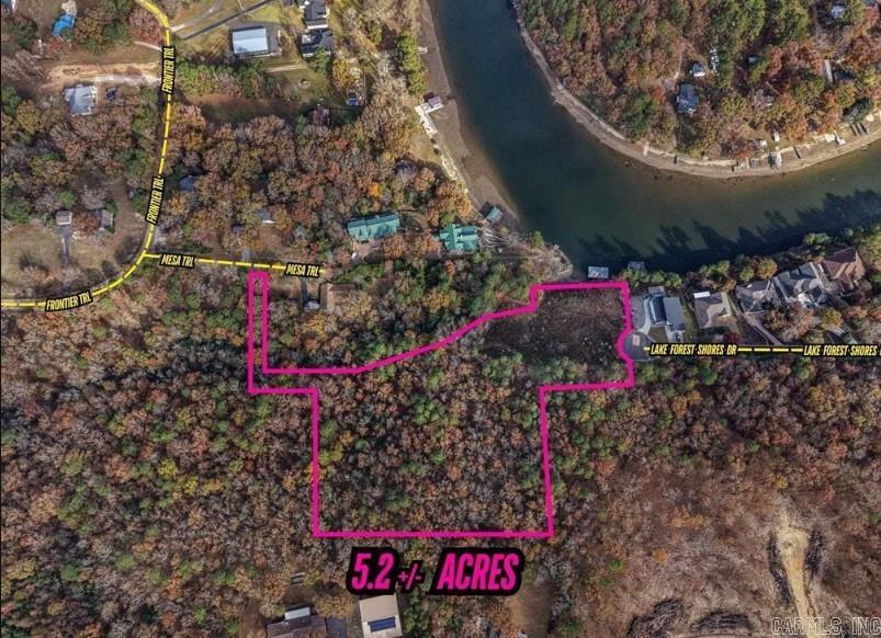 5.291 Lot on Lake Hamilton with over 200 ft of shoreline and a boat dock. This would be perfect for someone wanting acreage and the lake! Lot 17 and 18 of Lake Forest Shores and adjoining acreage that has access from Lake Forest Shores or Mesa Trail. More photos to come! AGENT REMARKS