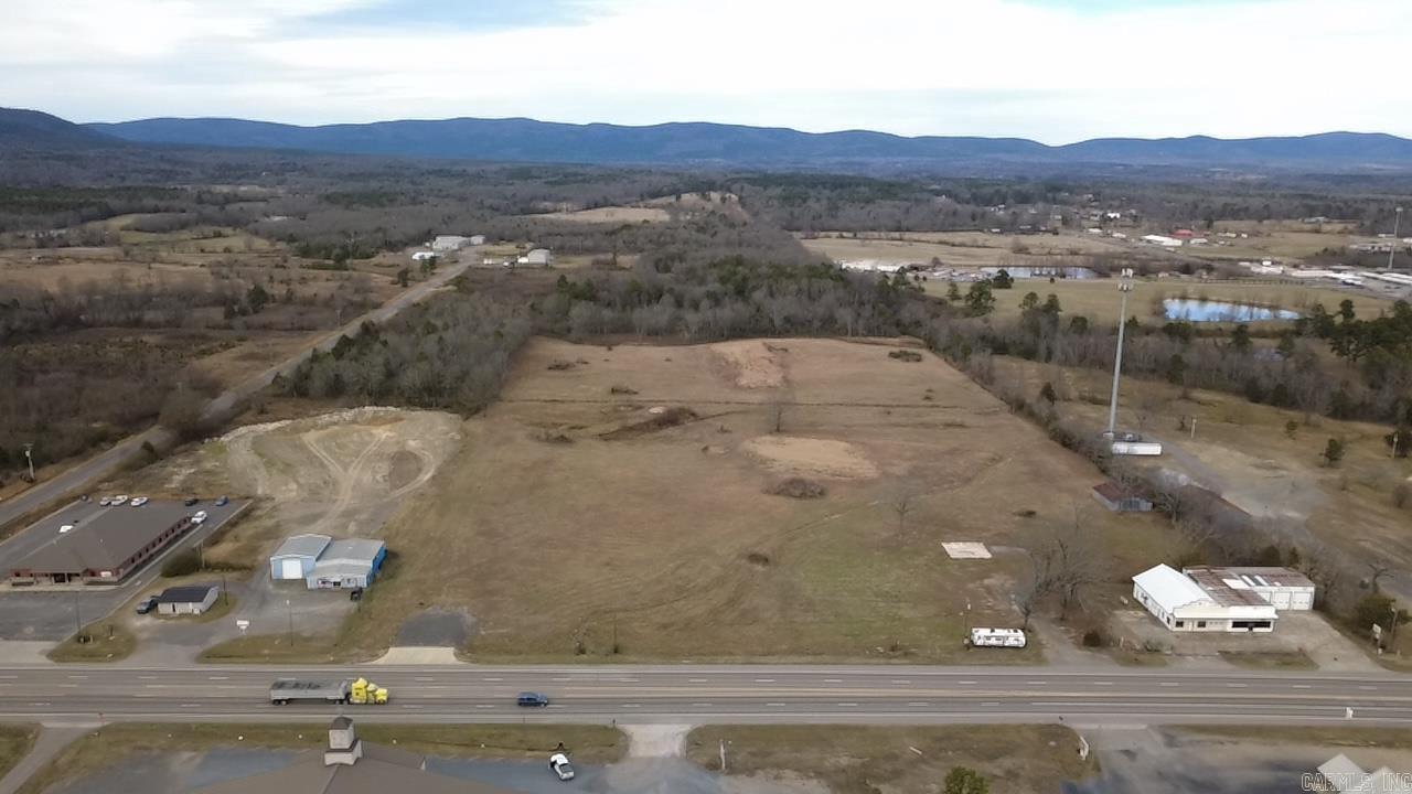 Prime Commercial Property on Highway 71 North  Unlock the potential of this expansive 9.22-acre commercial property, ideally situated along the bustling Highway 71 North in Mena. With excellent visibility and easy access, this cleared and ready-to-build lot is perfect for a variety of business ventures. Its strategic location near the town’s edge and close proximity to the industrial park make it an ideal spot for commercial establishments such as gas stations, retail centers, or other hard-commercial uses. Don’t miss the opportunity to be part of Mena's growth and development!