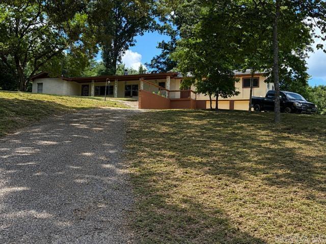 Spacious country home on approximately 2.75 acres in the Bismarck School District! Offering approximately 2,369 sq. ft. of living space, this property provides the perfect opportunity for those looking to enjoy peaceful country living while adding their own finishing touches. The home features large living areas, hardwood and tile flooring, eat-in kitchen, spacious dining area, and plenty of room for family and entertaining. Several updates have already been completed, while some trim, flooring, sheetrock, and paint details remain, allowing the next owner to personalize the home and build immediate equity. The 2.75± acre setting offers privacy, room for gardening, recreation, or future improvements, all while being just a short drive to Bismarck, Hot Springs, DeGray Lake, and Arkadelphia where two prestigious universities are located. Being sold as-is. Don’t miss this opportunity to own a spacious home with acreage, character, and outstanding potential! Most furnishings to covey with sell of property. (Additional information available in Agent Remarks. Ask your agent for details.)