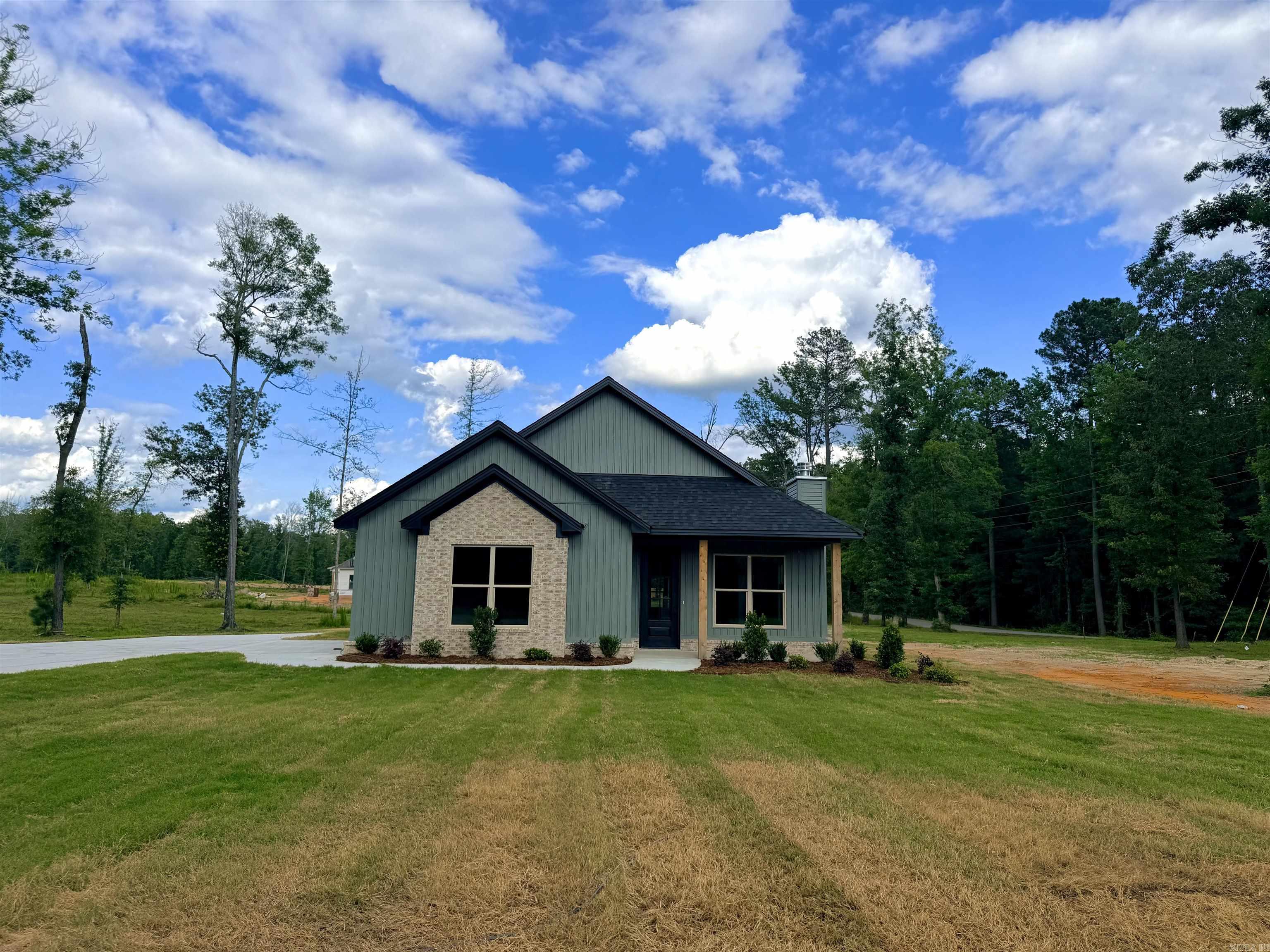 New Construction on almost an acre and a corner lot! This 3 bdrm/2 bath home offers 1850 sq ft of open concept living with beautiful LVF flooring and abundant natural light. The kitchen features a large island, quartz countertops, custom cabinetry, with stylish finishes. Spacious living room with brick fireplace & exposed beams. Split floorpan for added privacy. Enjoy peaceful country living while still being conveniently located close to town.