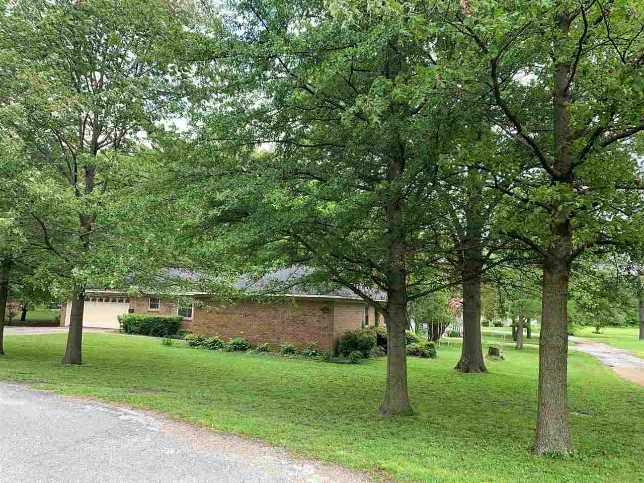 UPDATE: Seller will pay up to $2000 of Buyer's closing costs with a full price offer!  Beautiful property and a large landscaped lot complete with roses plus; pecan, walnut, magnolia, and hazel nut trees.  The kitchen has every appliance needed to host your next family gathering.  The current owners have updated the electrical/plumbing recently, the roof is 3 years old, a new dishwasher, added double pane windows and a furnace. Sprinkler system and a large shop