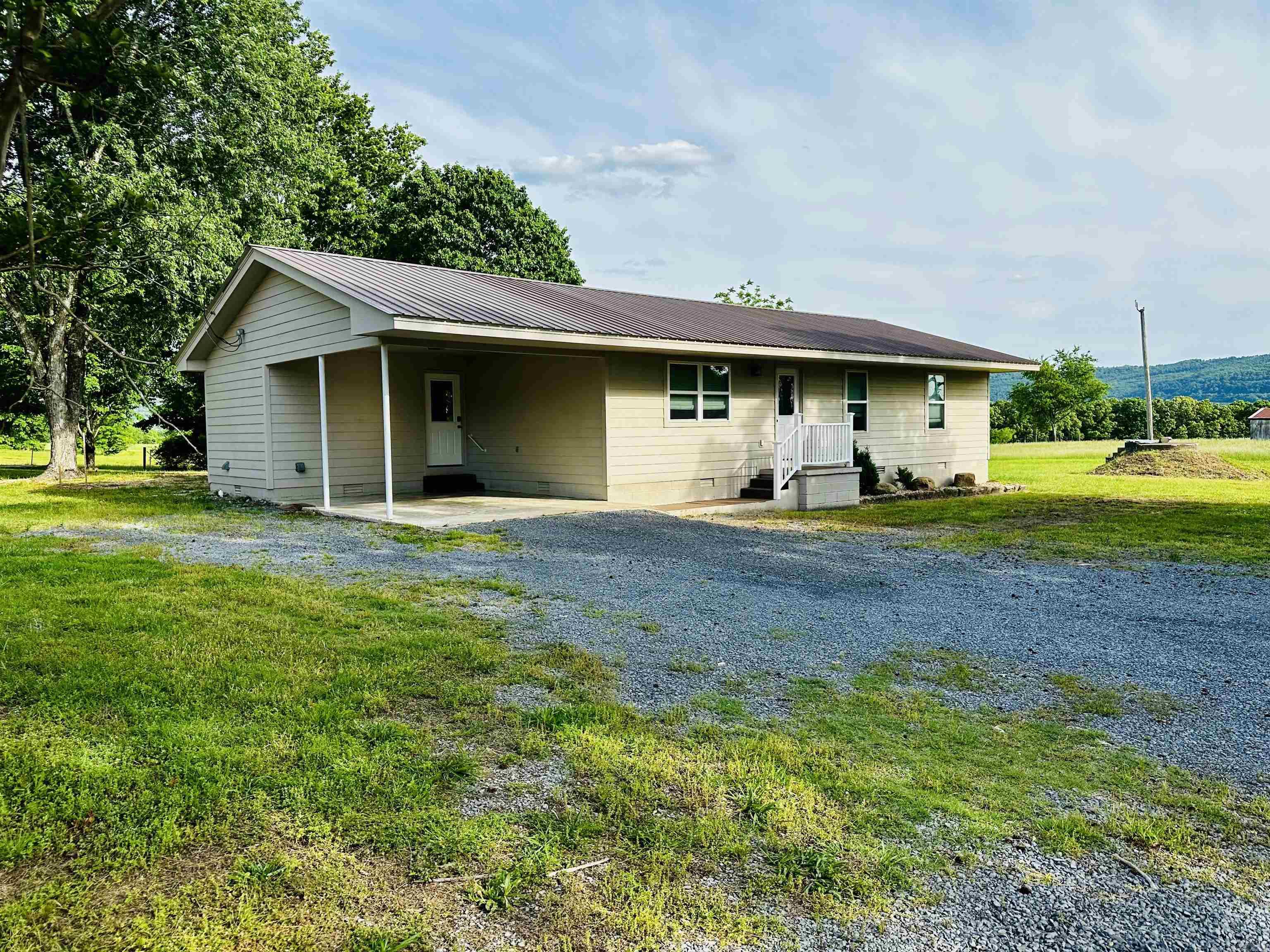 Charming remodeled home just outside Marshall, Arkansas! This 3-bedroom, 2-bath home offers 1,456 square feet of comfortable living space on approximately 1 acre, located just 1 mile from town and about 15 minutes from the Buffalo National River, giving you the perfect blend of peaceful country living with easy access to amenities and outdoor recreation. Enjoy scenic mountain views right from your doorstep, along with a storm shelter for added peace of mind, the laundry room offers 2 washer and dryer hookups. The well manicured lawn has plenty of room for other structures or a garden. This cozy property a true gem in the heart of Searcy County.