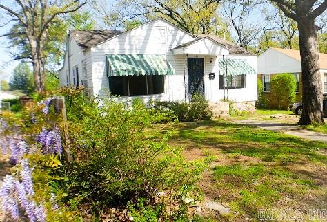 Great House! Refinished hardwoods, arched doorways, large windows, built in bookshelves, laundry/sun-room and detached garage.  A little TLC will go a long way with this one.  Sold "As Is" No Disclosures