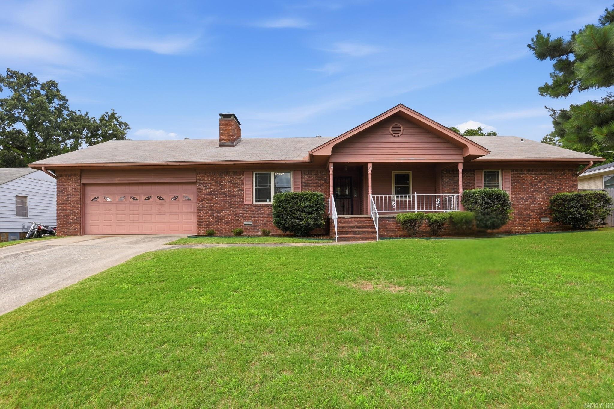 Move-in ready and refreshed throughout! This all-brick one-level home in the established Pike View neighborhood shines with brand-new luxury vinyl plank flooring and fresh, interior paint—just bring your boxes. Step inside to a spacious vaulted great room anchored by a striking floor-to-ceiling brick fireplace and filled with natural light. With over 2,100 sq ft, there's room to spread out, including multiple living areas and a formal dining room. The kitchen offers abundant cabinetry, stainless appliances, a gas range, and a breakfast-bar peninsula open to the living space—perfect for everyday living and entertaining. Retreat to generously sized bedrooms, all showing beautifully with the new flooring and paint, plus a bath featuring a crisp white vanity and walk-in shower. Outside, enjoy a covered front porch, an attached 2-car garage, and a large level yard on roughly a third of an acre. Conveniently located close to shopping, dining, schools, and easy interstate access. Don't miss this one—schedule your showing today!