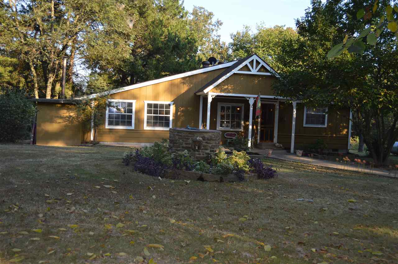 This adorable country home/mini farm is excellent for those wanting to enjoy the peaceful quiet of living in the country. Nestled on 4.35 acres, this property features a 3 bedroom / 1 bathroom home, patio, storm cellar, large shop with boom, garden area, and lots of room for raising a few animals or your own food. A large pecan tree provides lots of cool shade in the summer. The gas stove in the kitchen will be replaced with an electric stove.  A list of items that do not convey is available upon request.