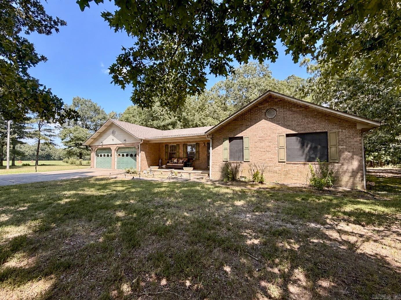 Beautifully maintained and move-in ready, this spacious home sits on 10 partially wooded acres, offering the perfect blend of privacy, open space, and comfortable living. Inside, the inviting living room features vaulted ceilings and a cozy gas fireplace, creating a warm space for gathering with family and friends. The kitchen is equipped with stainless steel appliances, granite countertops, abundant cabinetry, and is complemented by both a formal dining room and a large breakfast area, giving you plenty of room for everyday meals and entertaining. The oversized primary suite provides a relaxing retreat with ample space for large furniture, while the updated ensuite bathroom showcases a stunning tiled walk-in shower and granite vanity. Fresh paint throughout gives the home a clean, modern feel, and the additional bedrooms offer generous space for family or guests. Step outside to enjoy the peaceful setting, where the partially wooded acreage provides room to roam, explore, or simply enjoy the views. A shop with electricity offers the perfect space for hobbies, storage, or projects.