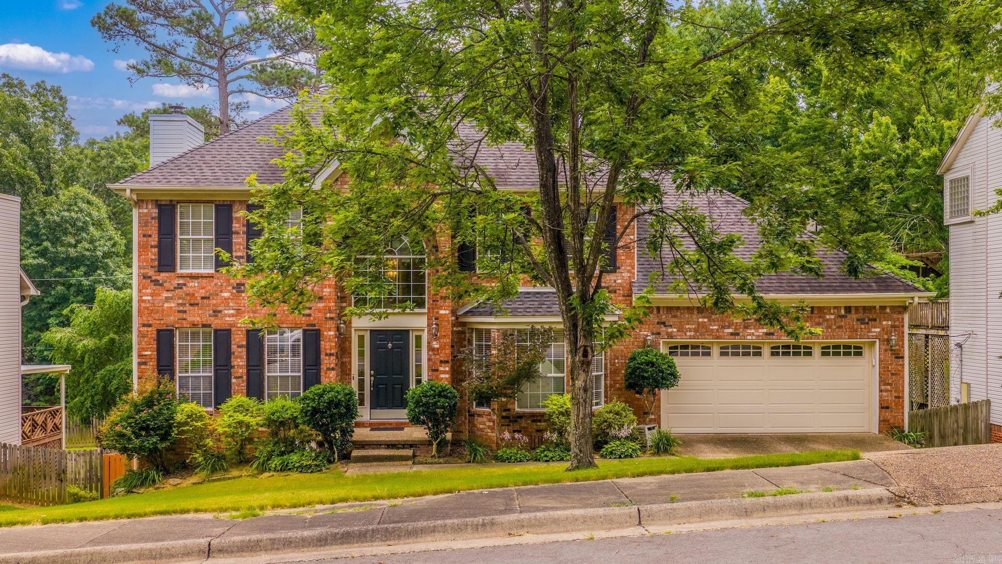 Located in the highly sought-after Don Roberts and Pinnacle View school zones, this beautifully maintained traditional two-story brick and vinyl home offers the perfect blend of space, comfort, and convenience. Featuring 3 bedrooms, 2.5 baths, and durable laminate and luxury vinyl plank flooring throughout, this home is move-in ready. The spacious kitchen boasts granite countertops, stainless steel appliances, a center island, pantry, and breakfast area overlooking the oversized backyard. Enjoy gatherings in the inviting living room with a wood-burning fireplace and built-ins, or entertain in the separate dining room. The large primary suite offers a generous walk-in closet, walk-in attic access with abundant floored storage, and a spacious bath with double vanities, whirlpool tub, and separate shower. A bonus room downstairs provides the perfect space for a home office or additional storage.Outside, you'll love the large fenced backyard complete with a deck, fire pit, and plenty of room for kids and pets to play. Two-car garage, separate laundry room, and a family-friendly neighborhood just minutes from shopping, dining, parks, and all West Little Rock conveniences make this home.