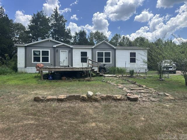 Endless possibilities await with this unique country property in Adona! Situated on approximately 79 acres, this property offers the perfect blend of privacy, open space, and rural living. The mobile home provides a comfortable place to live while you enjoy everything the land has to offer. Whether you're looking for a working far, recreational property, hunting retreat, or the ideal location to build your dream home, this acreage is full of potential. With plenty of room for livestock, trails, gardening, or simply enjoying the peace and quiet of the Arkansas countryside, opportunities like this don't come along often. If you've been searching for acreage with a home already in place, don't miss your chance to own this versatile property. Schedule your private showing today! AGENTS 24hr notice. Schedule through showingtime.