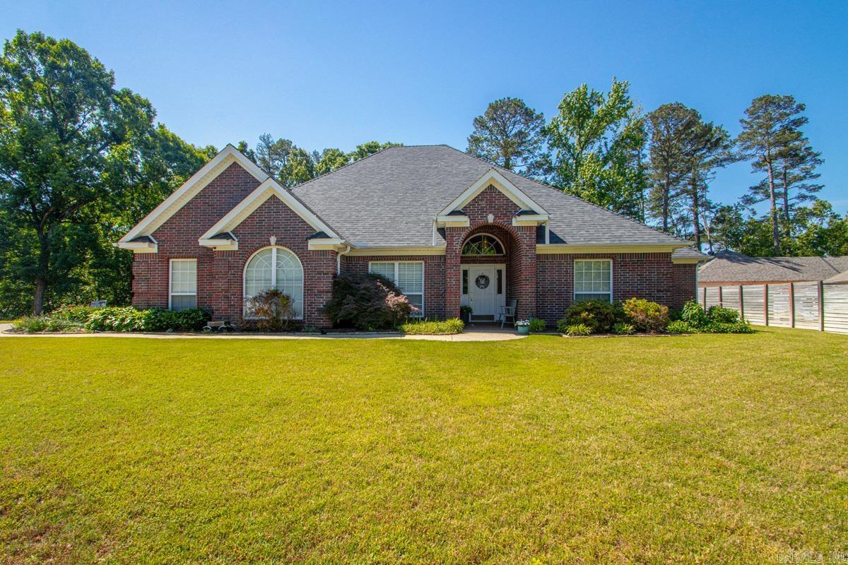 Introducing 1425 River Pointe Court in Benton, AR.  Nestled in a gated cul-de-sac, this immaculate 2537 sq. ft. home consists of 4 bedrooms and 3 full baths. As you enter the home, your eyes will be drawn to the stunning arched doorways and beautiful hardwood floors.  The nice sized living room has a gas fireplace flanked by pretty windows and the beautiful formal dining room ready to entertain guests.  You are going to love the gorgeous granite in the kitchen with stainless steel appliances and breakfast bar that opens to the bright breakfast nook. This leads out to the place where you can enjoy a good cup of coffee on the back patio.  The Master suite has large windows, a great his and hers vanity area with jetted tub and walk-in shower.  The second bedroom is extremely large with double closets and could easily sleep a couple kids and have plenty of room to play.  The nice sized laundry room includes a sink area with hanging space.  You will love the great storage this house has and don’t miss the three-car garage.  This home is ready to welcome it’s new family.