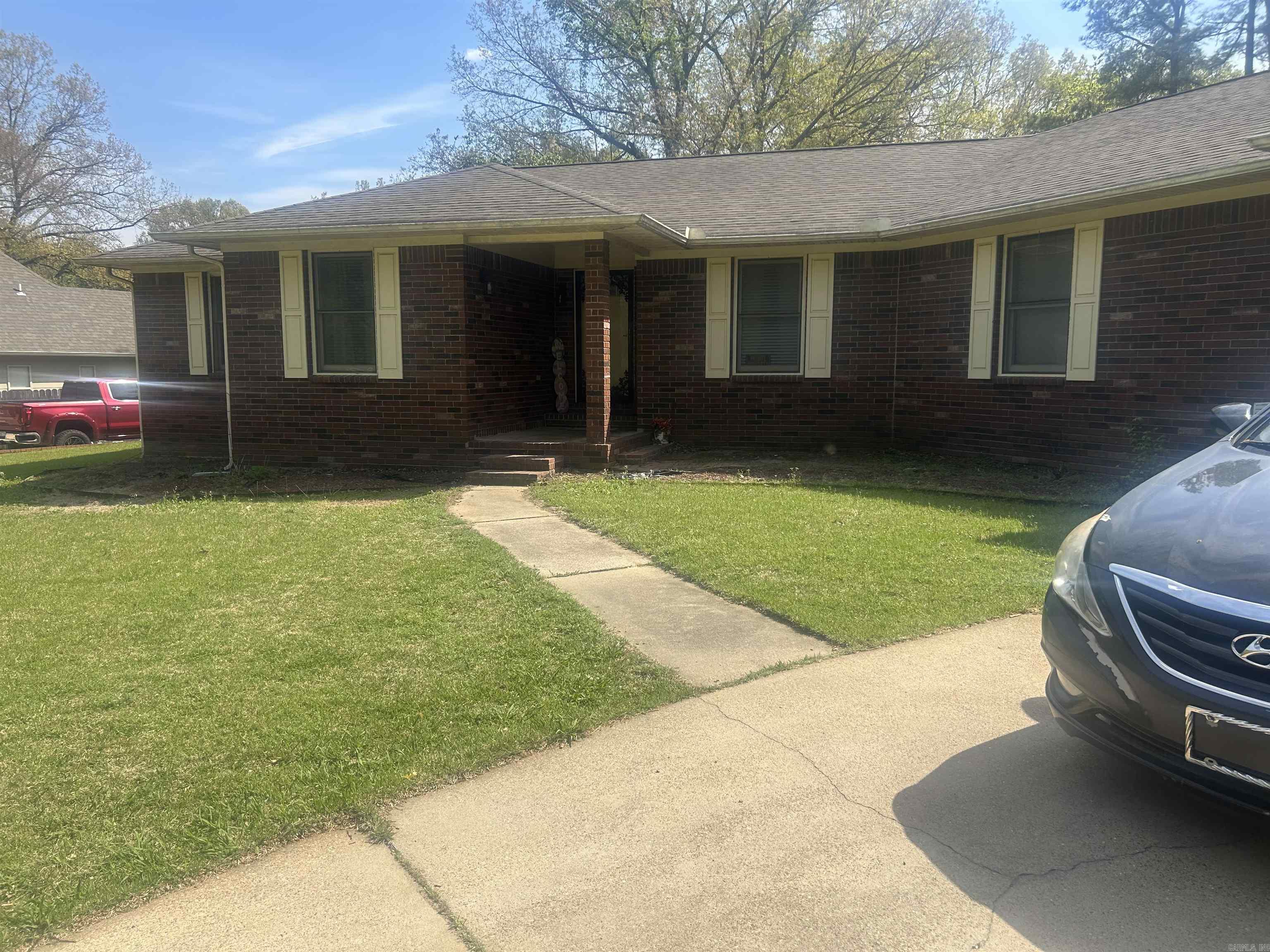 Welcome to this spacious and well-maintained 3-bedroom, 4-bathroom home located in the desirable Scottsmeadow Subdivision in Forrest City, AR!!! This inviting property offers a comfortable layout with plenty of room for both everyday living and entertaining. Step into the living room, where you'll find a charming brick wood-burning fireplace that creates a warm and welcoming atmosphere perfect for relaxing evenings at home. The kitchen is thoughtfully designed for both functionality and style, featuring a gas range, electric double ovens, abundant cabinet and counter space, and a convenient pantry to meet all your storage needs.  Each of the three bedrooms is generously sized and includes walk-in closets, providing plenty of space and comfort. The primary suite serves as a private retreat with its own spacious bathroom, complete with a double vanity, separate shower, and soaking tub. The hall bathroom also features a double vanity, offering added convenience for family or guests.  Additional highlights include a half bathroom located in the garage, ample storage throughout the home, and practical features designed for everyday ease.