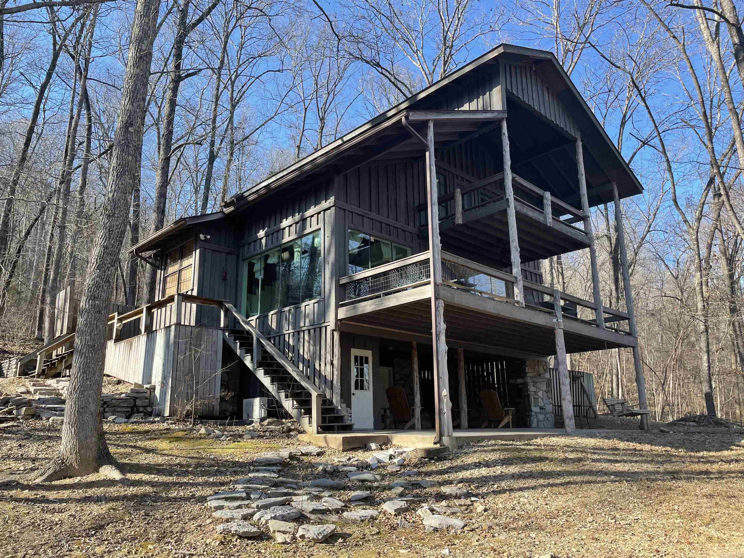 Creekfront Retreat on Sylamore Creek near Mountain View, AR! Nestled along the banks of beautiful Sylamore Creek, this charming 2-bedroom, 2½-bath home offers breathtaking creek views and a peaceful natural setting. Enjoy morning coffee or evening relaxation on the spacious creekside deck overlooking the flowing water—perfect for soaking in the sights and sounds of the Ozarks. Inside, the home features an open and inviting layout with a loft area that adds flexible living space, along with a separate sleeping loft ideal for kids or guests. Thoughtfully designed for comfort and functionality, this home provides a warm and welcoming atmosphere whether you’re escaping for the weekend or settling in full-time. Located just minutes from Mountain View and outdoor recreation, this property is well-suited for a weekend getaway, full-time residence, or an income-producing vacation rental. With its creekfront setting, scenic views, and unique layout, this Sylamore Creek home is a rare opportunity to own your own slice of Ozark paradise.