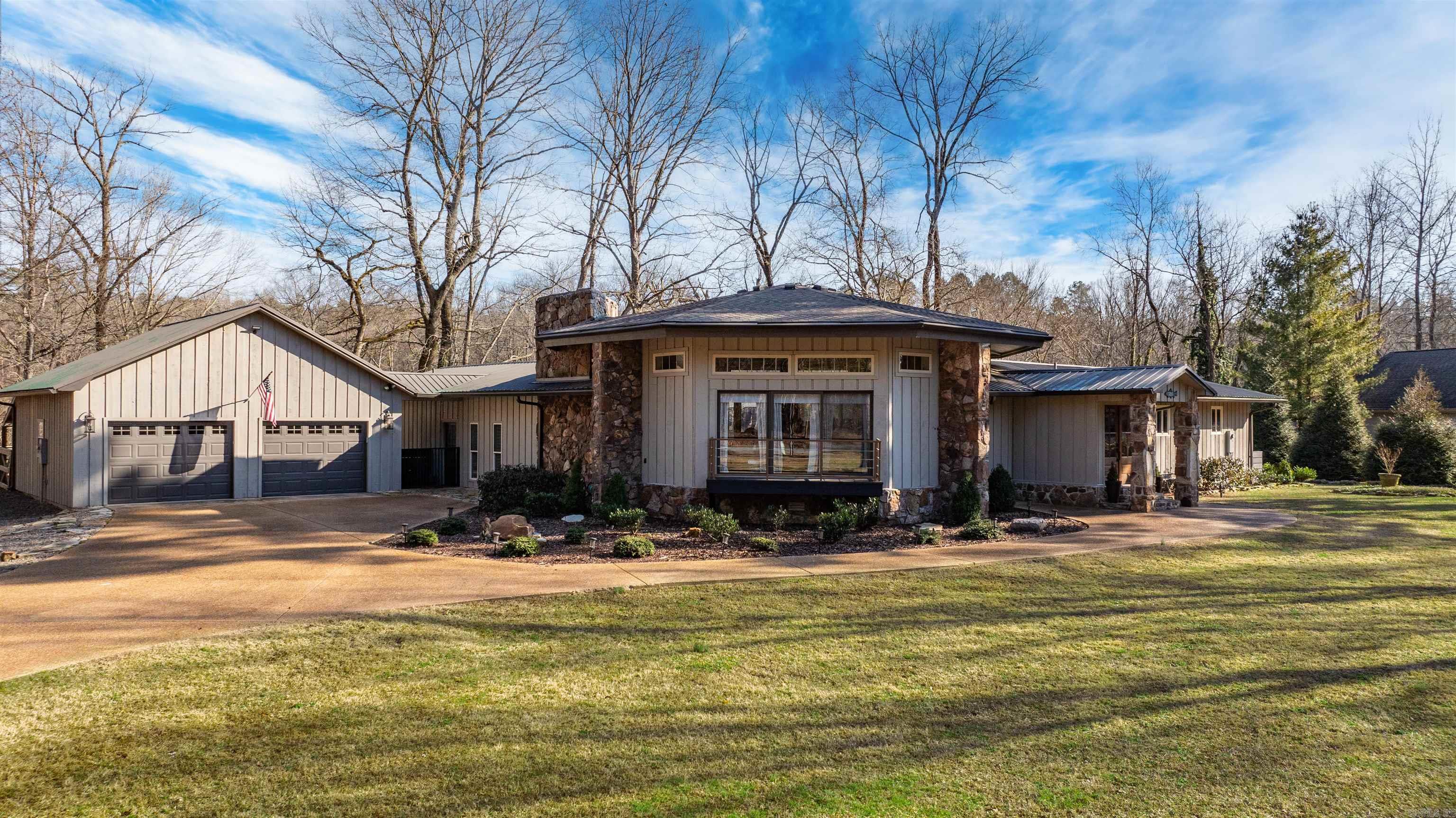 Fully furnished, luxury riverfront home on the scenic Little Red River, completely remodeled and move-in ready. Situated on three riverfront lots with stunning water views from every room. Features an open-concept kitchen and dining area with 16’ wood ceilings, custom finishes, Durasein countertops, wine cooler, and ice machine—ideal for entertaining. Offers 3 bedrooms, including 2 primary suites, and 3 full baths. Enjoy the screened porch, beautiful terraced landscaping, and two private boat docks providing easy river access. A rare turnkey opportunity combining comfort, elegance, and exceptional riverfront living.  Call today for a personal tour!